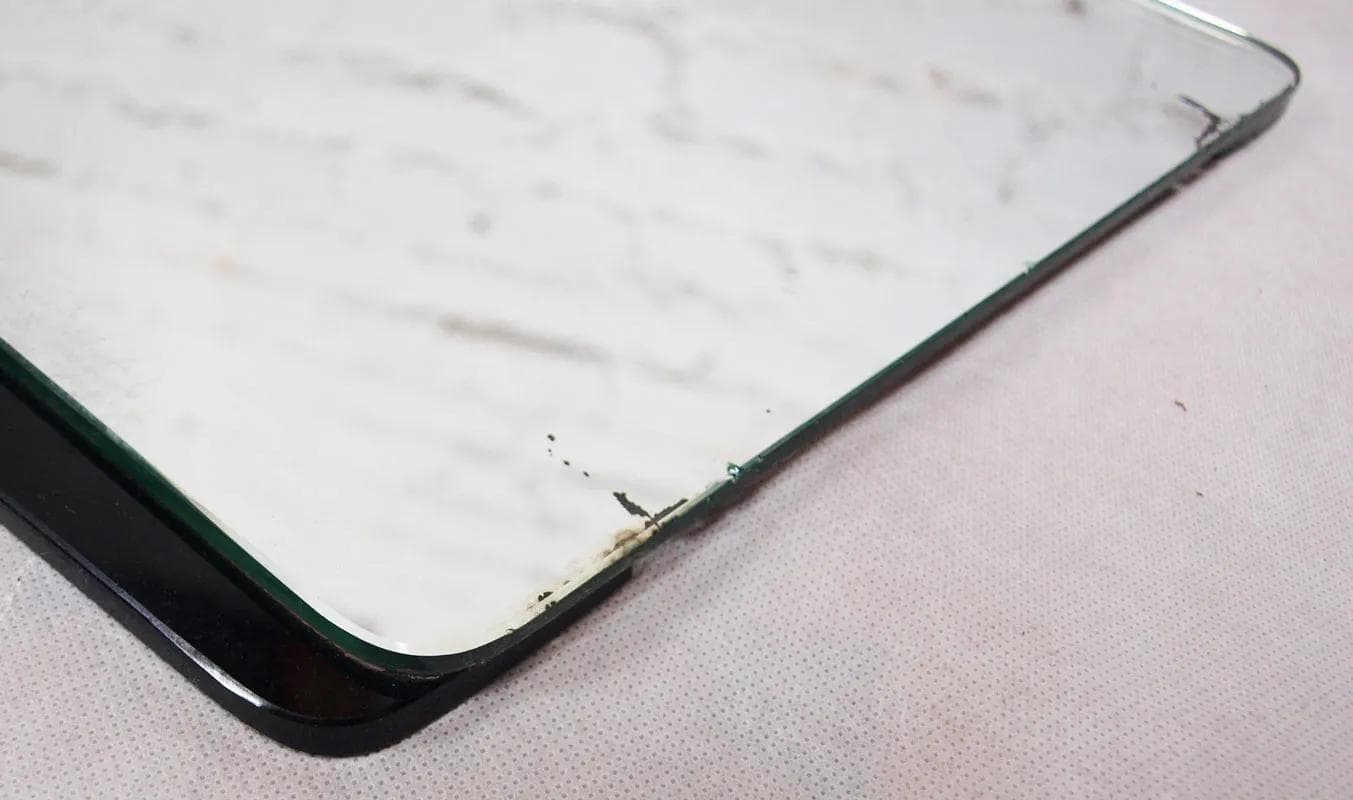 Wall mirror, black glass, Germany, 1960s. - 15974