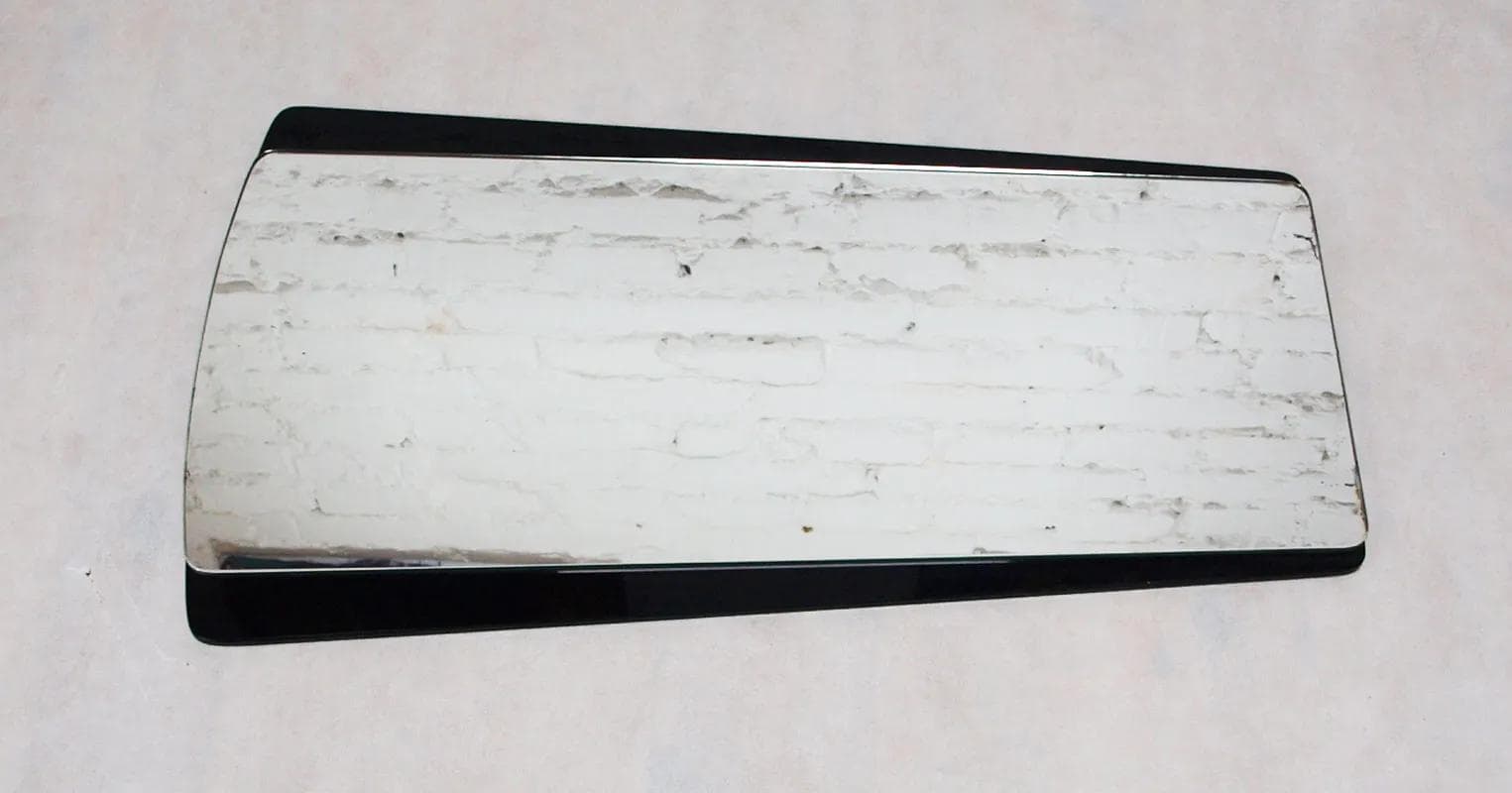 Wall mirror, black glass, Germany, 1960s. - 15971