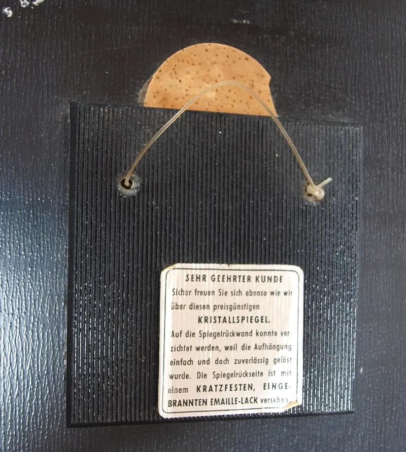 Wall mirror, black glass, Germany, 1960s. - 15975