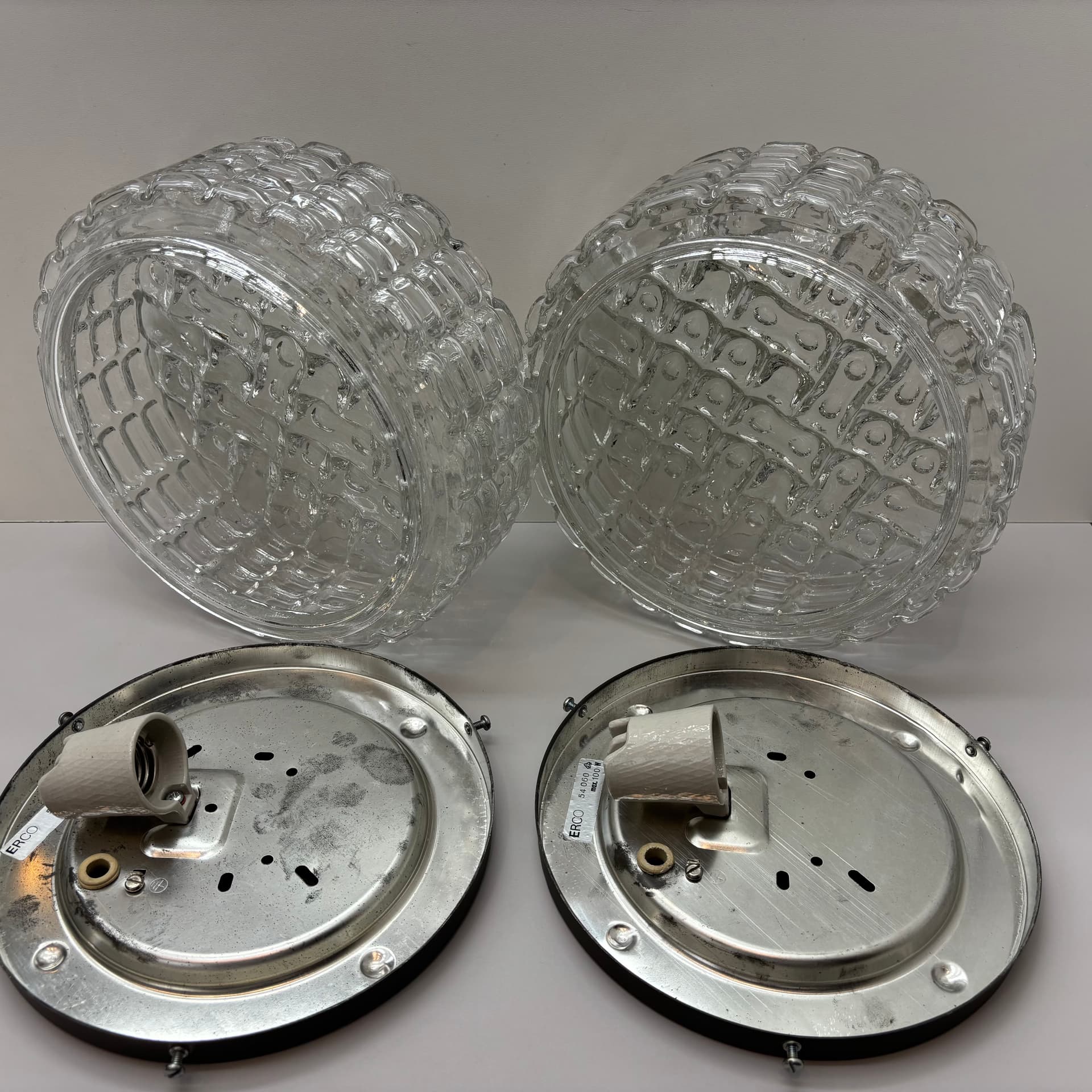 Pair of geometric wall sconces, transparent glass, metal, ERCO, Germany, 1970s. - 225758