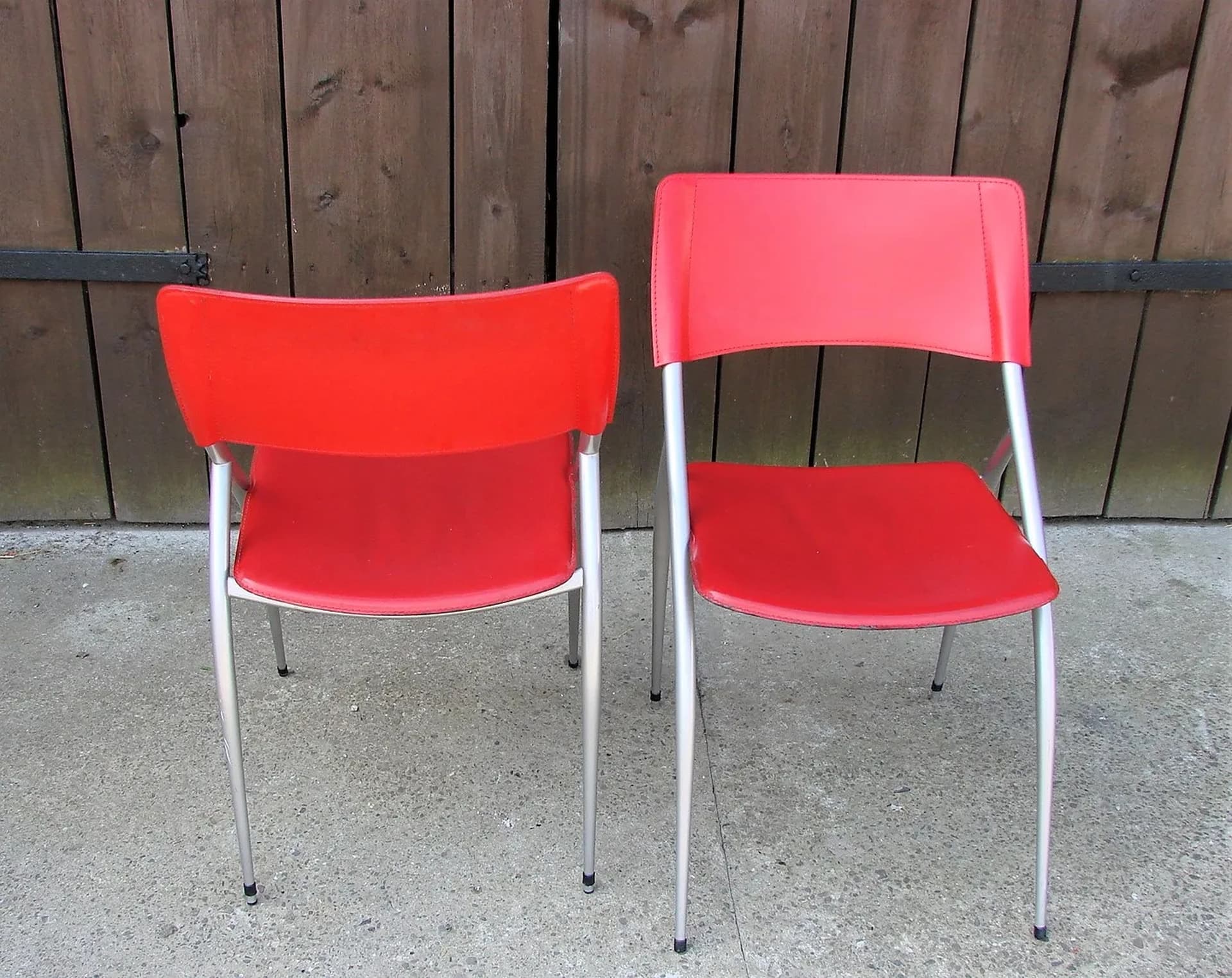 Pair of chairs, red, leather, brushed steel, Calligaris, Italy, 1990s. - 227208