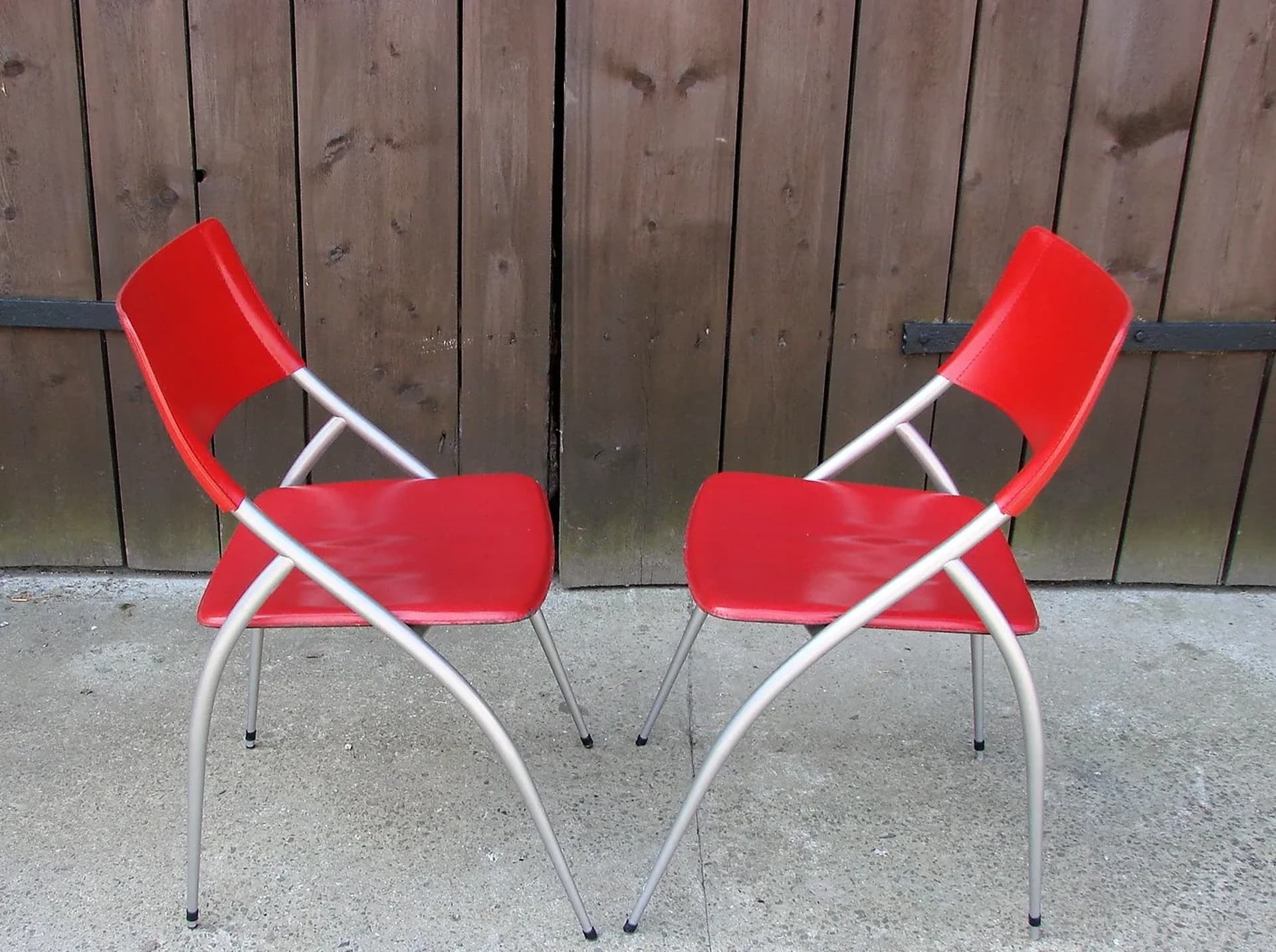 Pair of chairs, red, leather, brushed steel, Calligaris, Italy, 1990s. - 227207