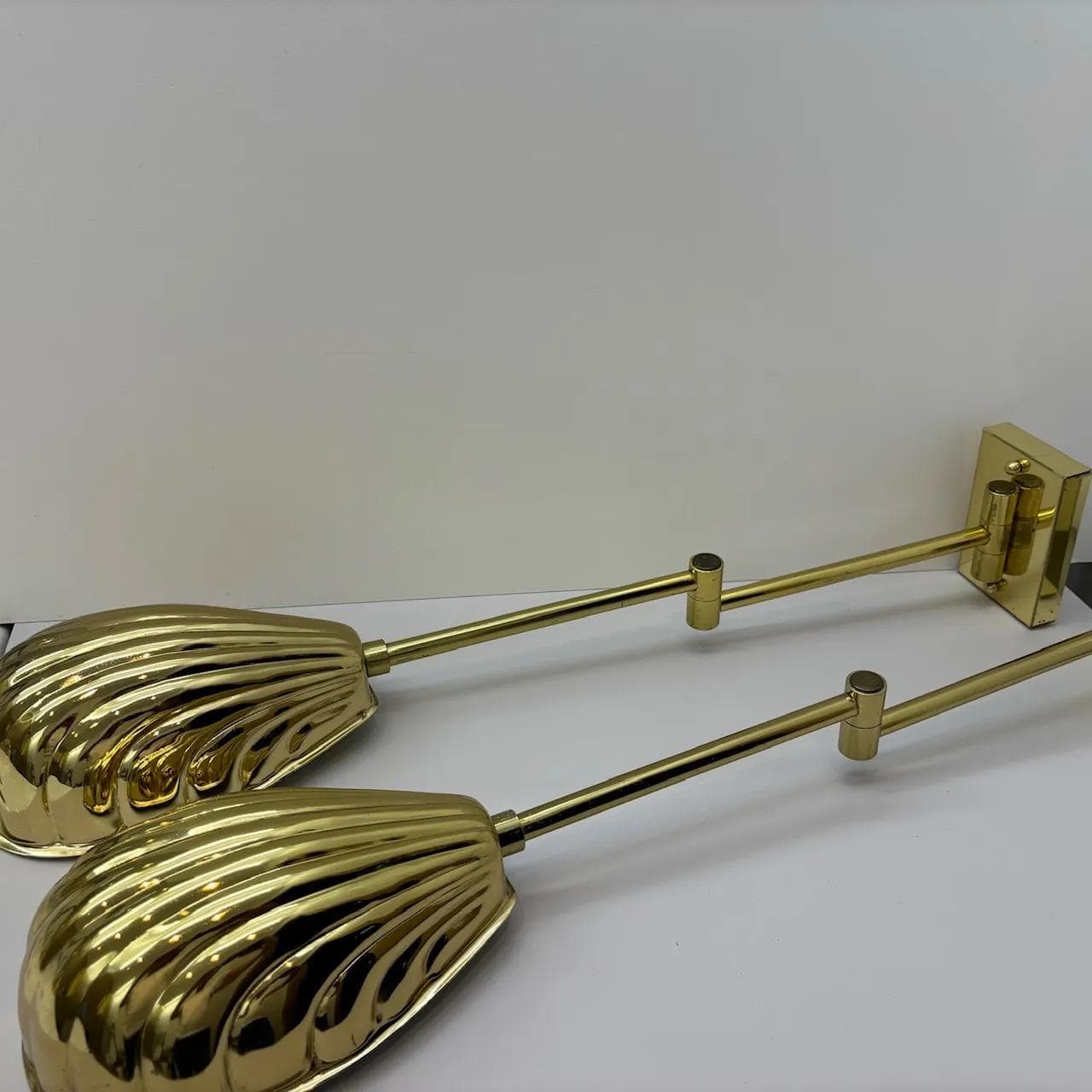 Pair of wall sconces Hollywood Regency, golden, steel brass, USA, 1970s. - 16576