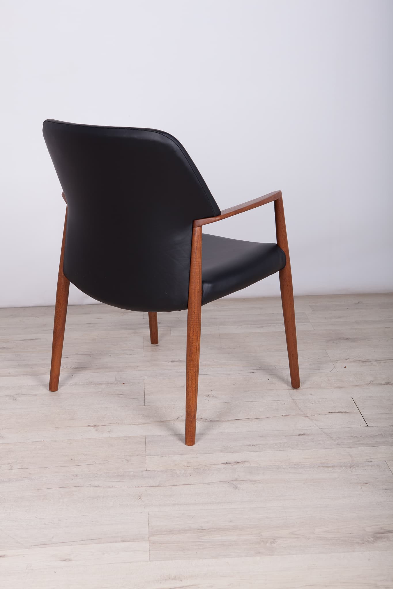 Armchair, teak, black leather, by A. B. Madsen, E. Larsen, Fritz Hansen, Denmark, 1950s. - 243600