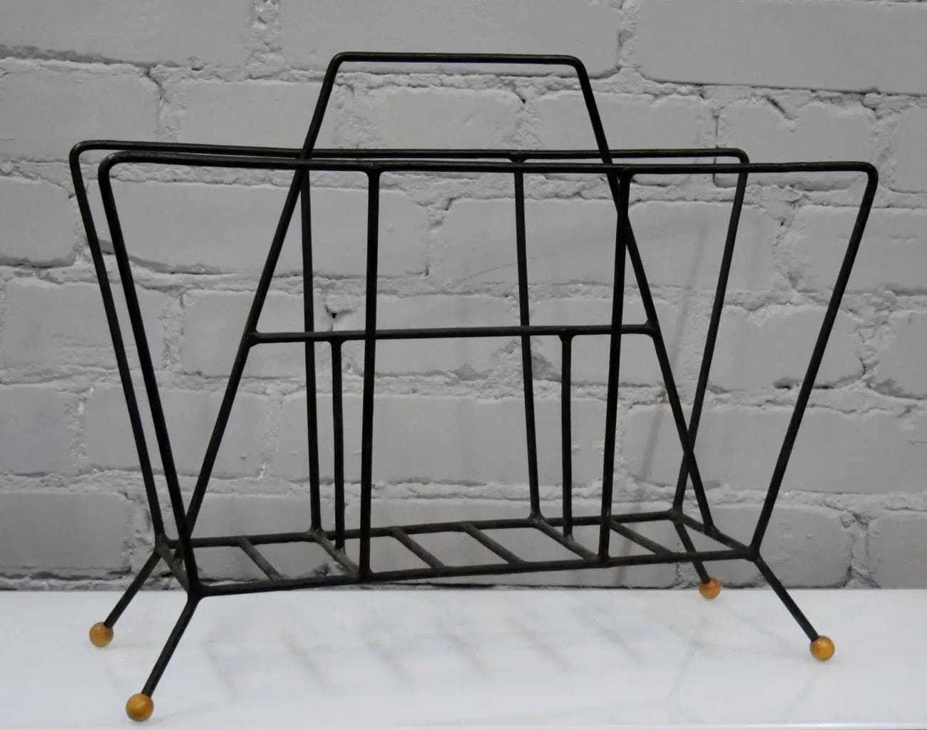 Magazine rack, black metal, by T. Paul, USA, 1950s. - 18824