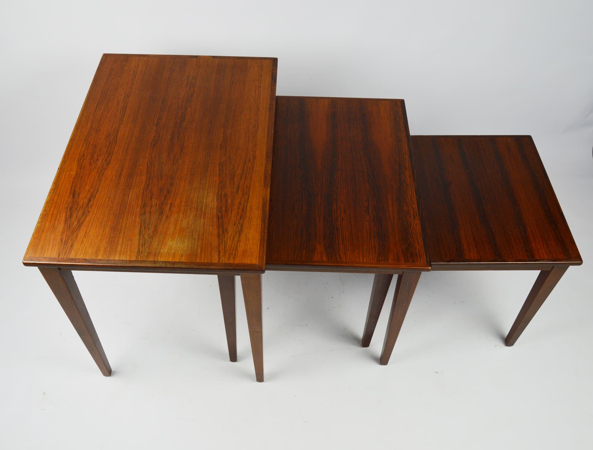Set of three side tables, brown wood, 1970s. - 261657