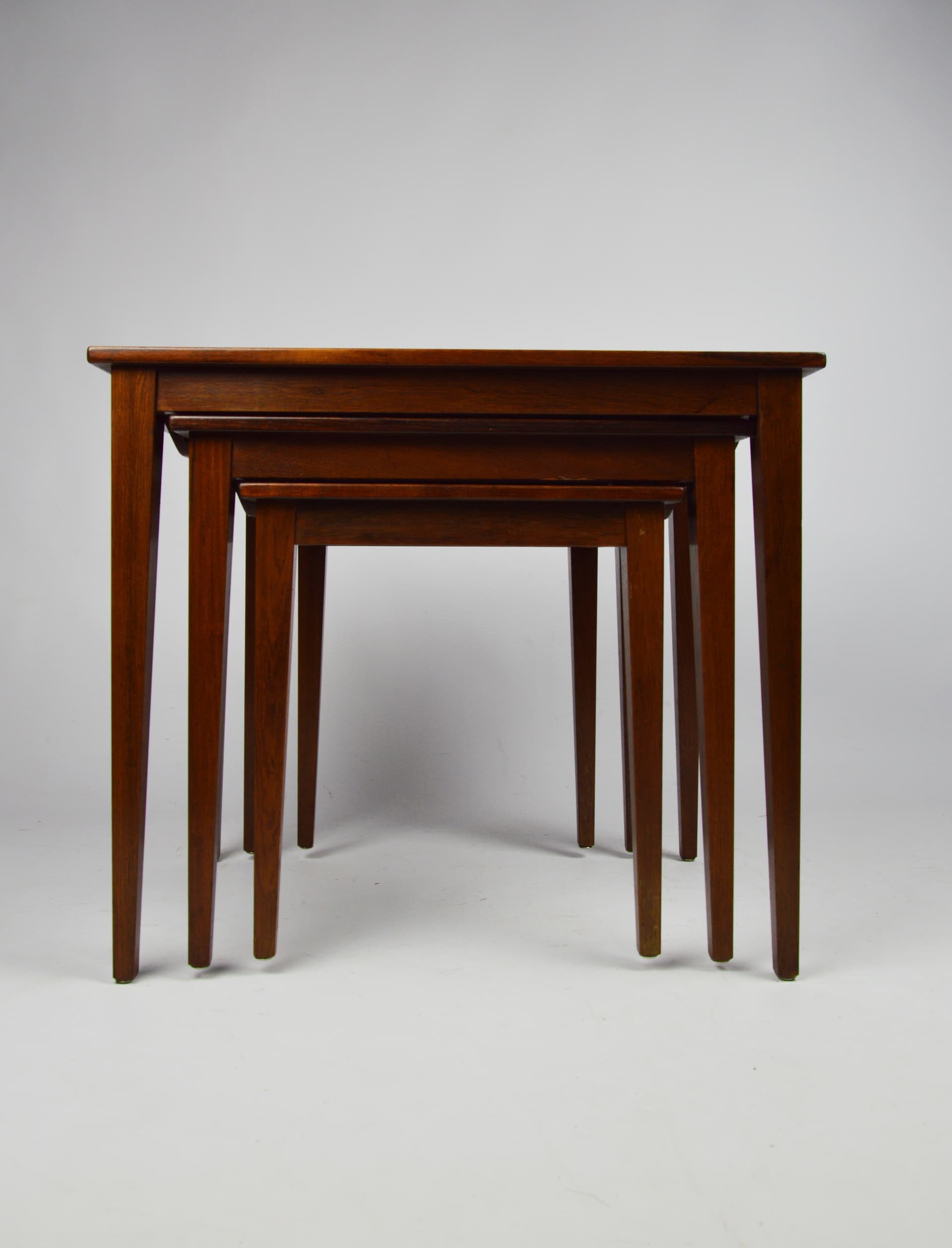 Set of three side tables, brown wood, 1970s. - 261658
