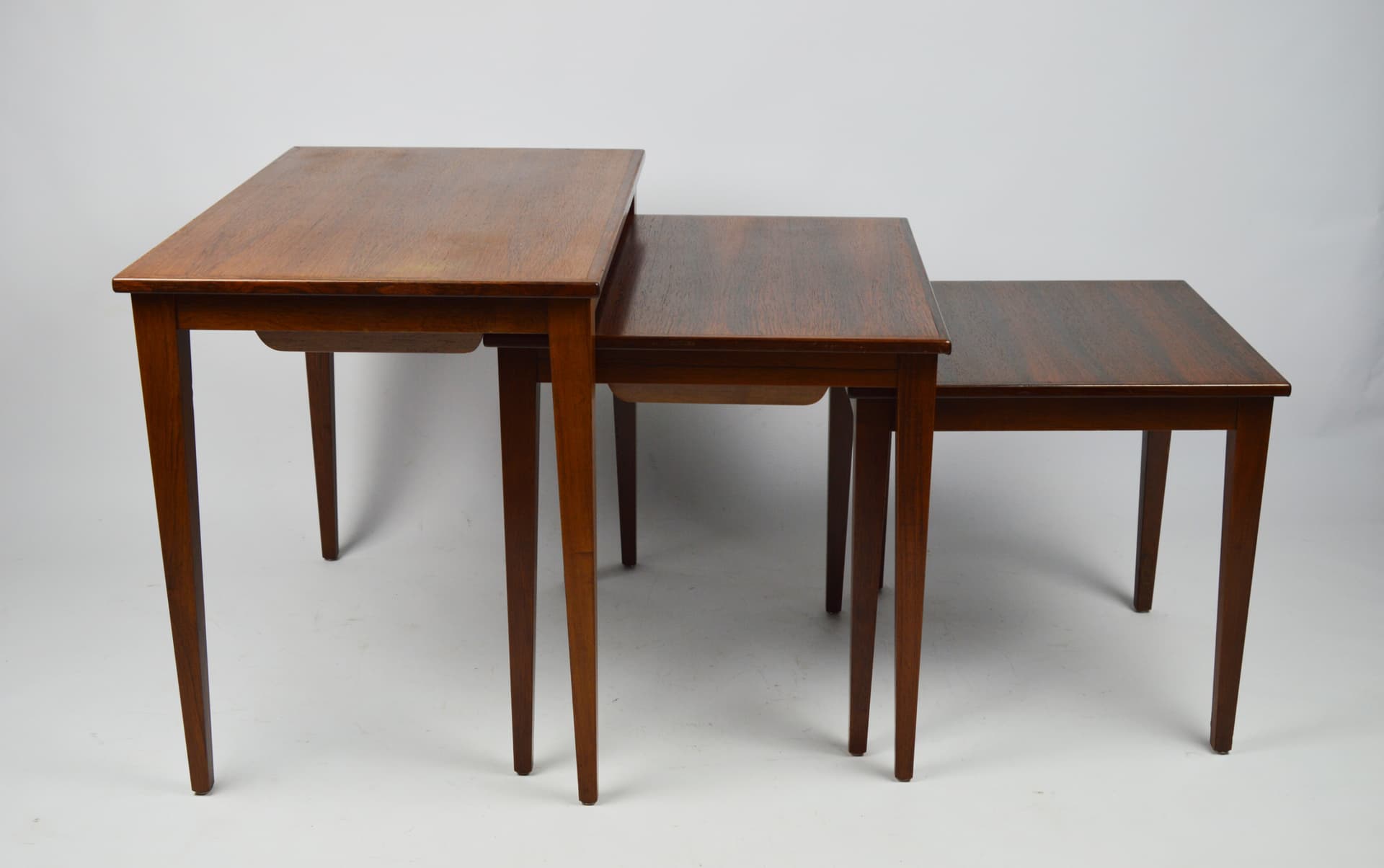 Set of three side tables, brown wood, 1970s. - 261655