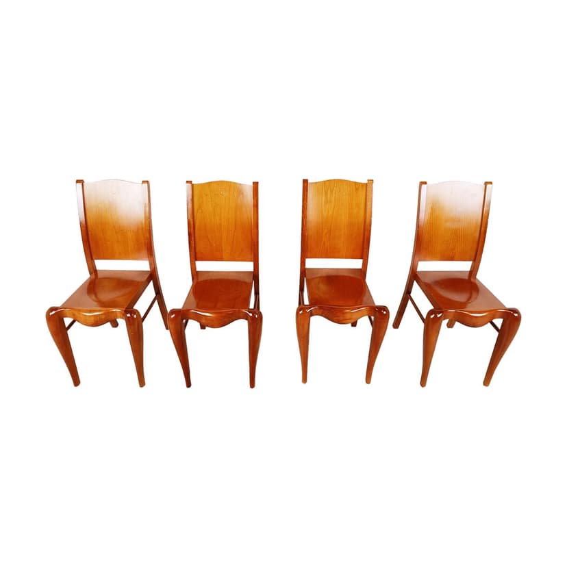 Set of Four Dining Chairs Placide, brown wood, by P. Starck, Driade, Italy, 1980s.
