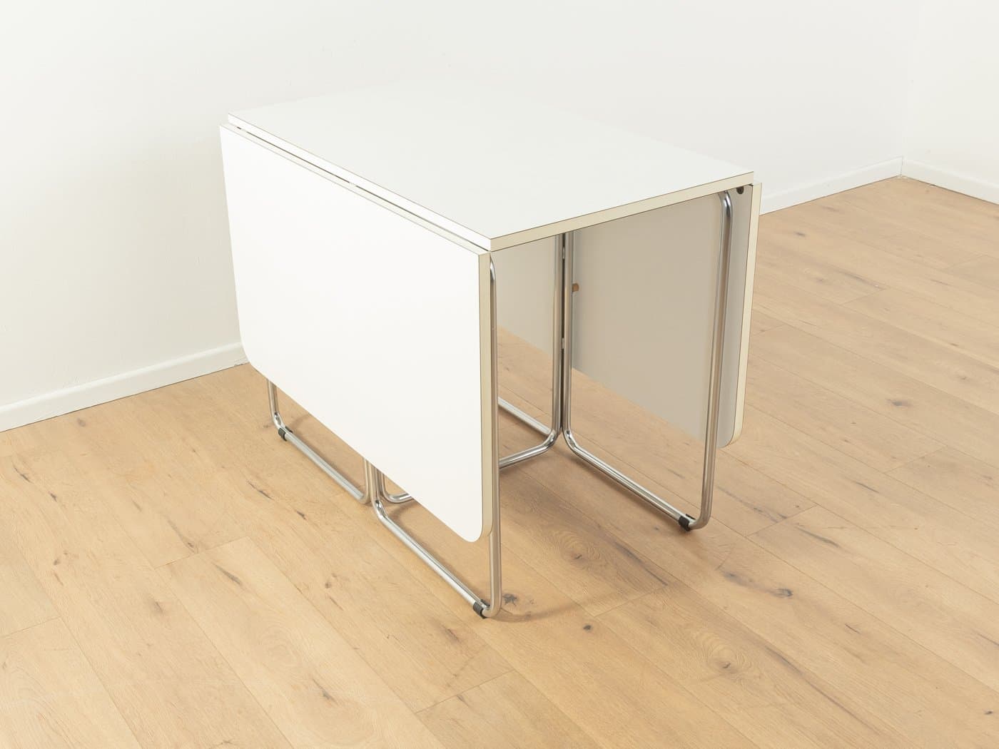 Folding table, white laminate, chromed steel, by C. Taube, Germany, 1970s. - 283175