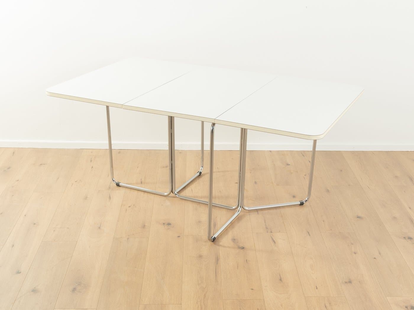 Folding table, white laminate, chromed steel, by C. Taube, Germany, 1970s. - 283176