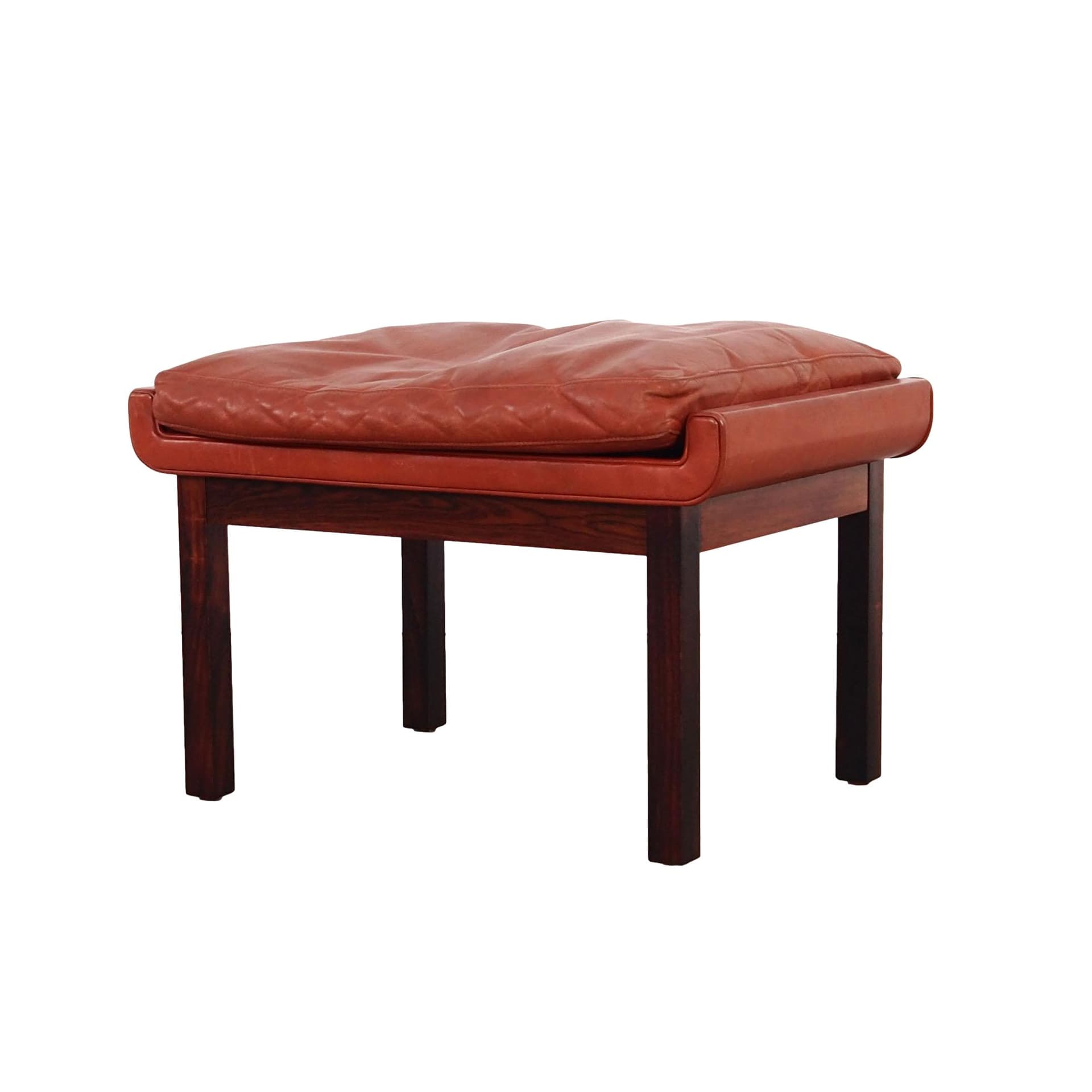 Ottoman, brick red leather, rosewood, by F. Juhl, Denmark, 1970s.