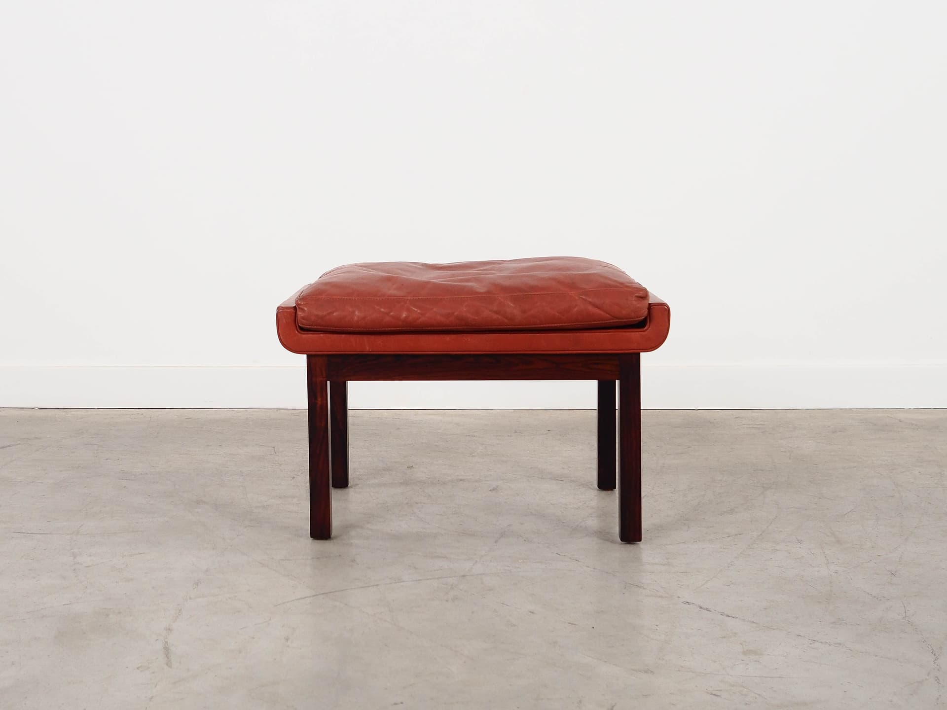 Ottoman, brick red leather, rosewood, by F. Juhl, Denmark, 1970s. - 298784