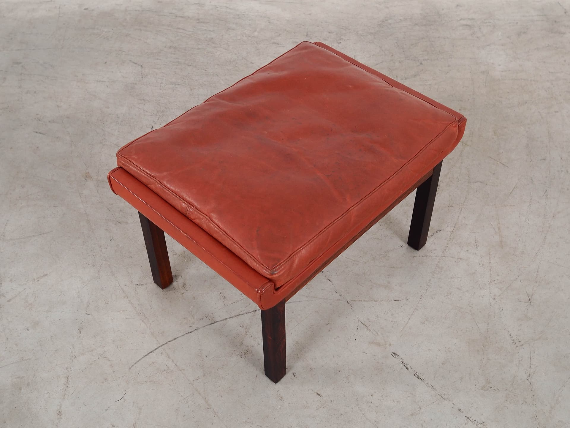 Ottoman, brick red leather, rosewood, by F. Juhl, Denmark, 1970s. - 298787