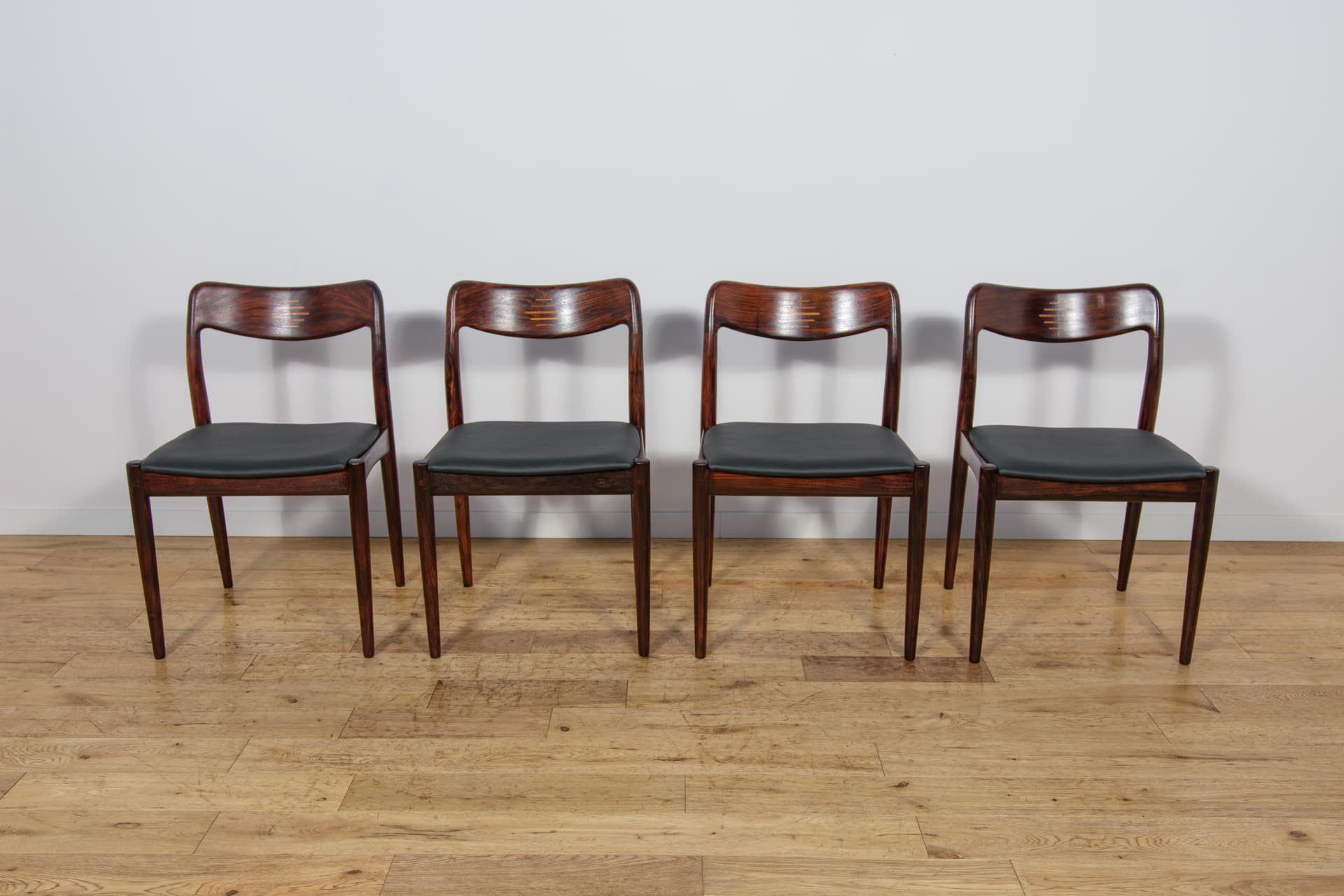 Set of four chairs, brown rosewood, black genuine leather, Uldum Møbelfabrik, Denmark, 1960s. - 298796