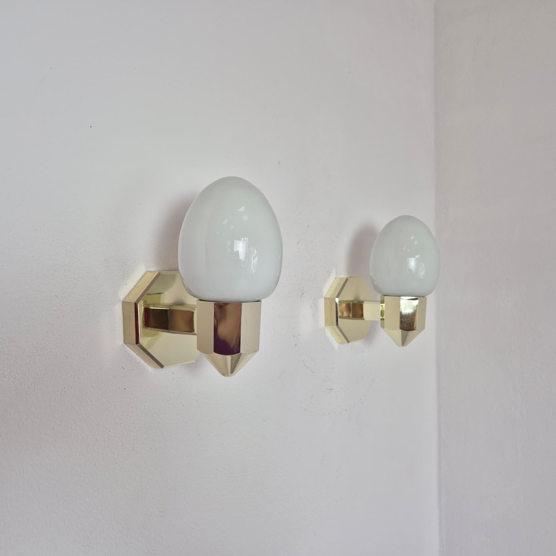 Pair of wall sconces, gold plastic, white glass, Germany, 1980s. - 300024
