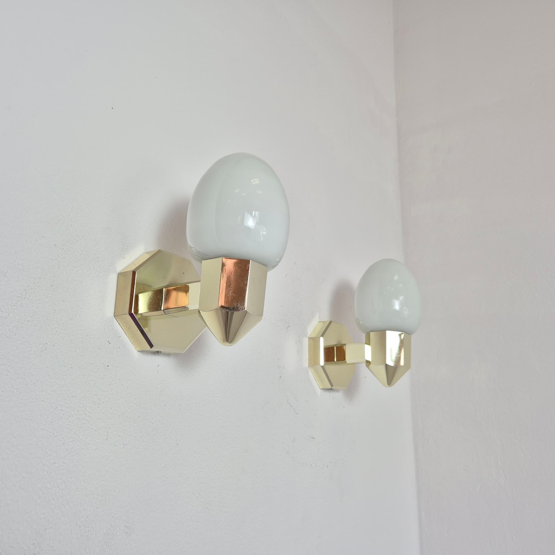 Pair of wall sconces, gold plastic, white glass, Germany, 1980s. - 300027