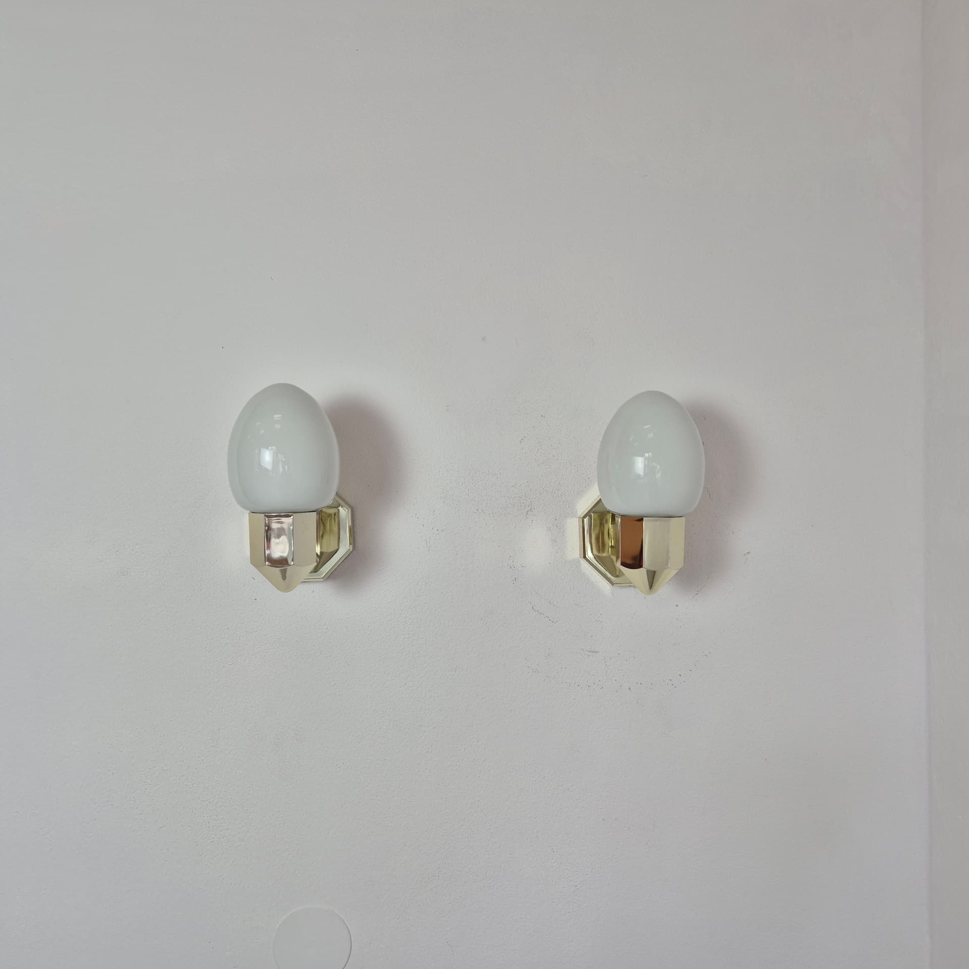 Pair of wall sconces, gold plastic, white glass, Germany, 1980s. - 300025