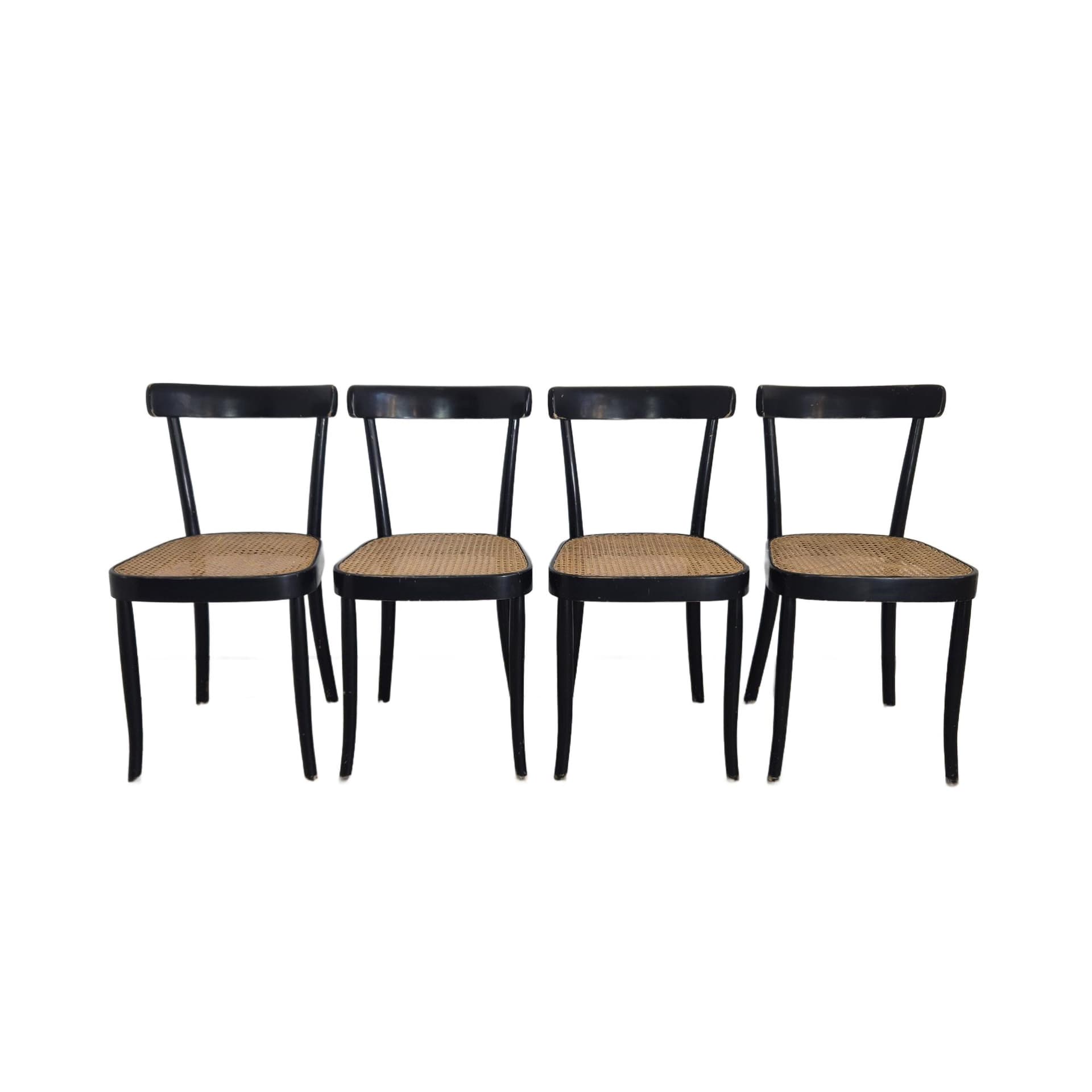 Set of chairs, black wood, brown rattan, by M. Moser, Horgenglarus, Switzerland, 1940s.