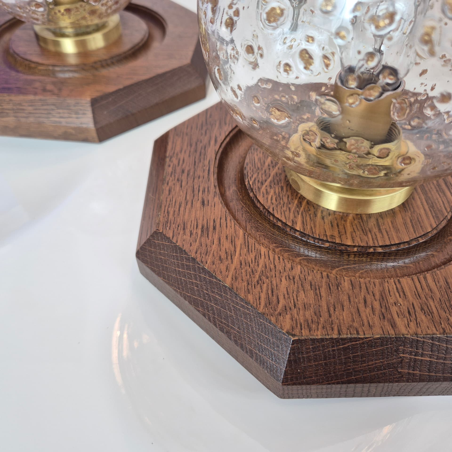 Pair of hexagonal wall sconces, brown wood, transparent glass, gold brass, Temde Leuchten, 1970s. - 300367