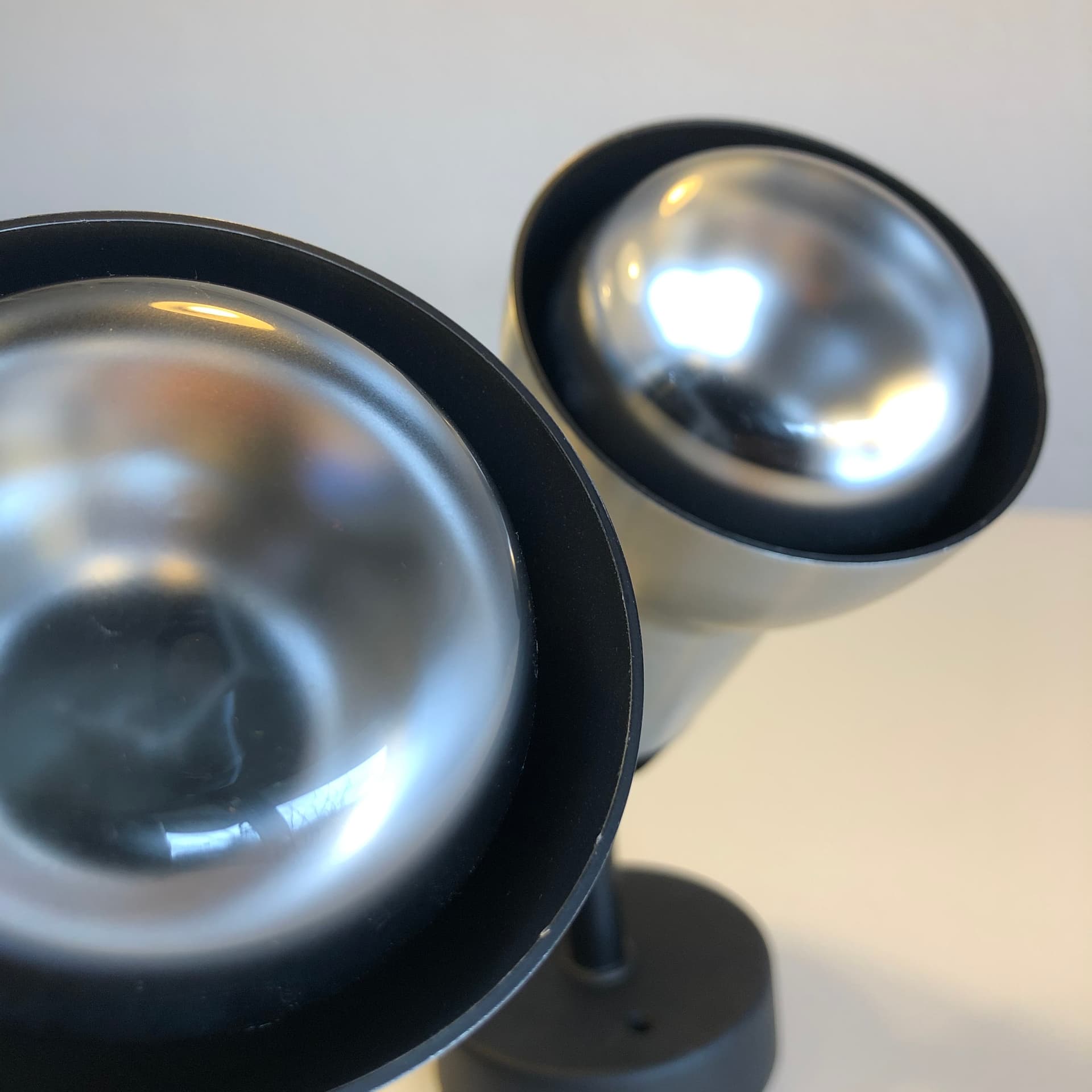 Pair of wall sconces, brushed silver aluminum, black metal, Staff Leuchten, Germany, 1970s. - 300621