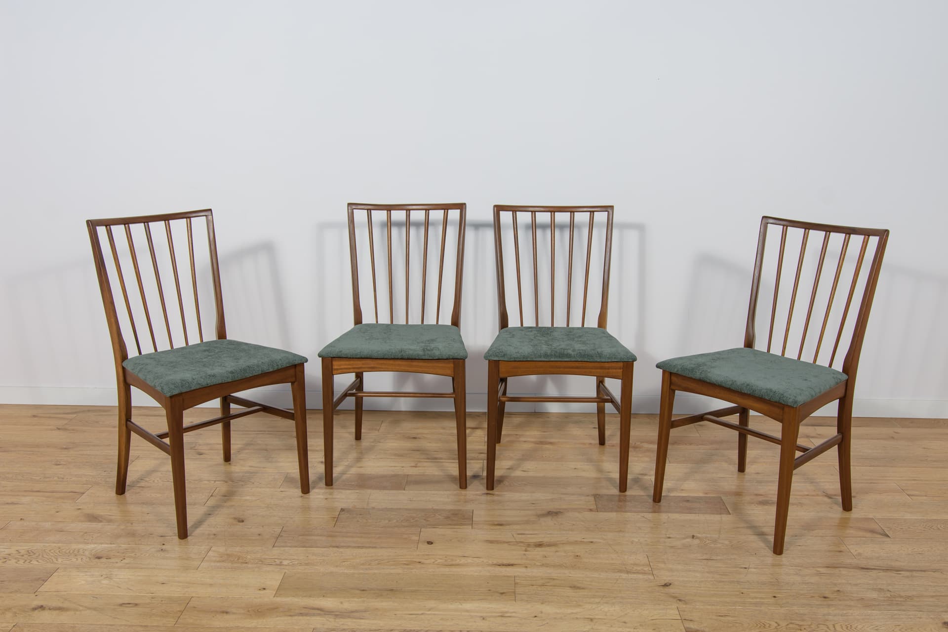 Set of four chairs, brown teak, green fabric, United Kingdom, 1960s. - 302874