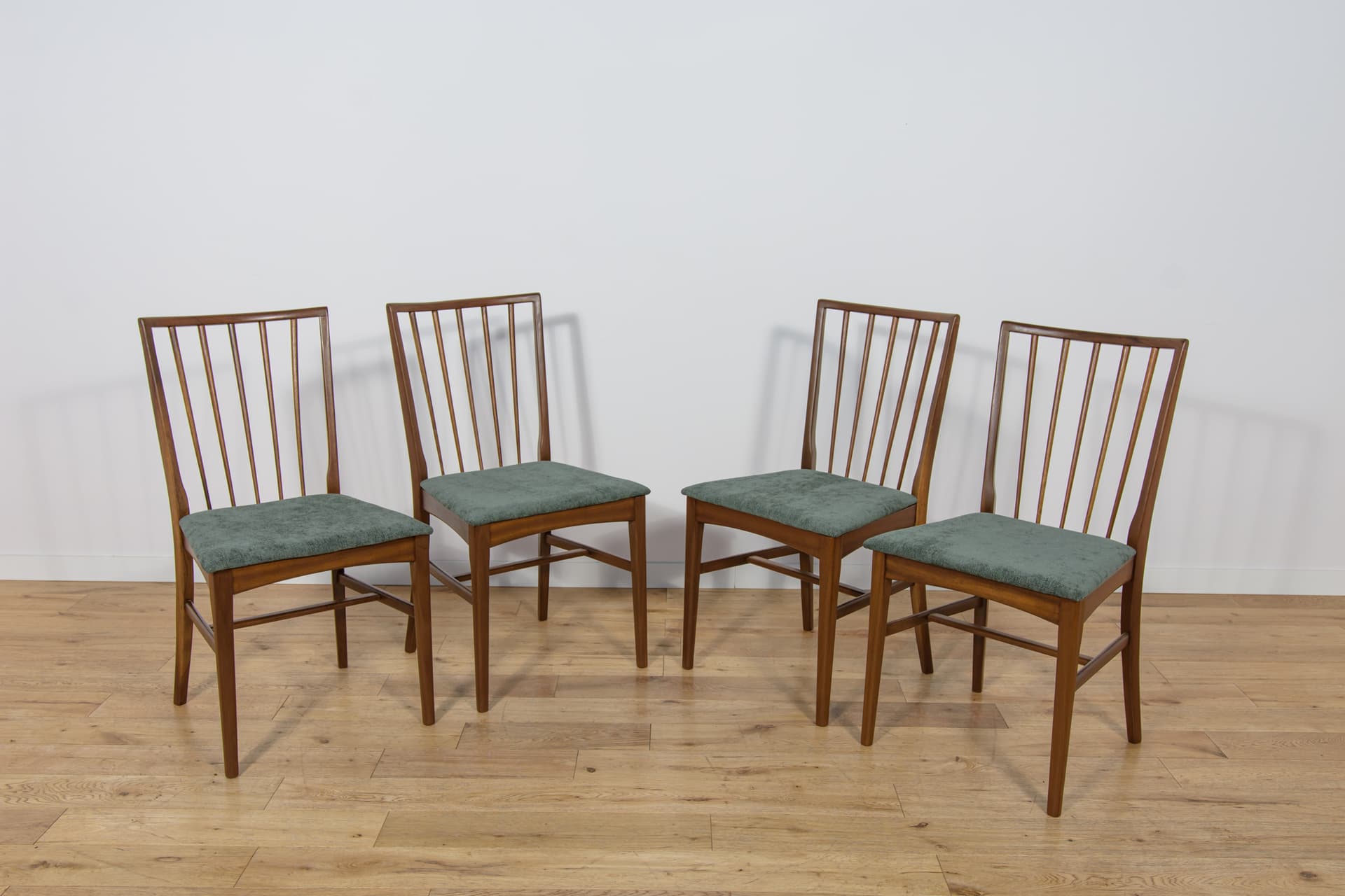 Set of four chairs, brown teak, green fabric, United Kingdom, 1960s. - 302875