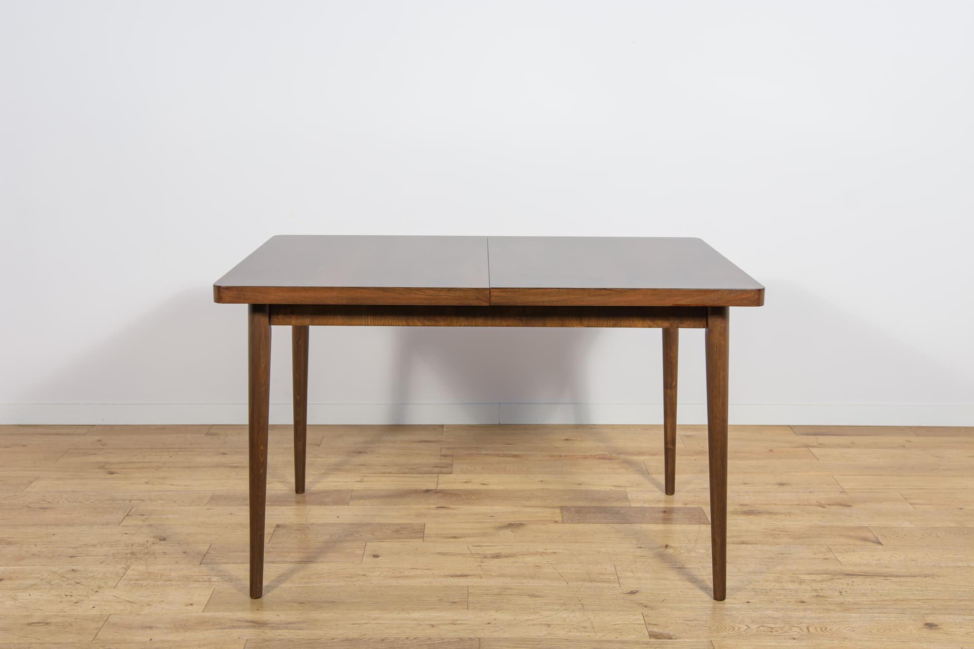 Extendable table, brown walnut, beech, by B. Landsman, H. Nepozitek, Jitona, Czechoslovakia, 1960s. - 304500