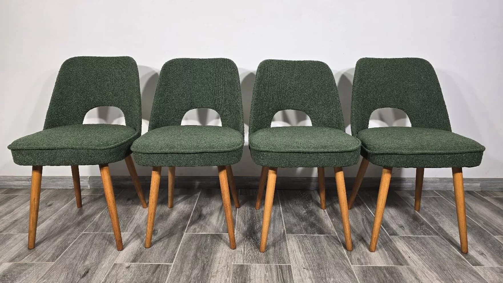 Set of four chairs, green bouclé, oak, by O. Haerdtl, Tatra Nabytok, Czechoslovakia, 1960s. - 305720