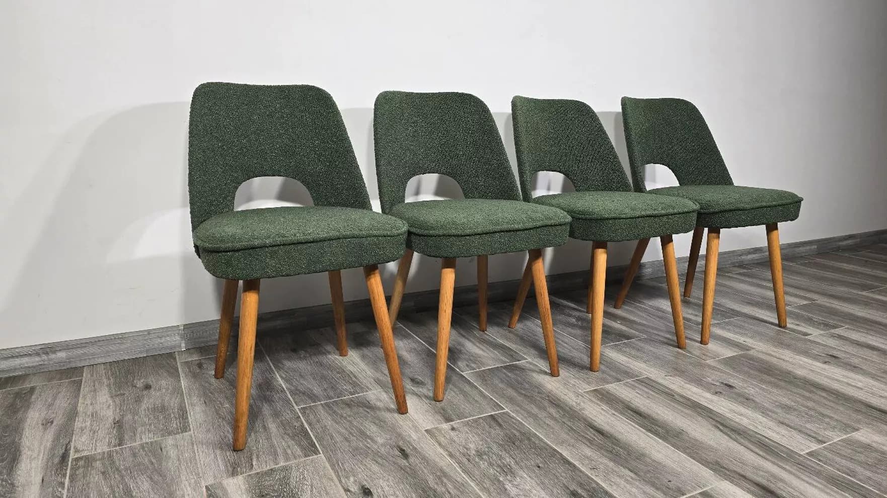 Set of four chairs, green bouclé, oak, by O. Haerdtl, Tatra Nabytok, Czechoslovakia, 1960s. - 305716
