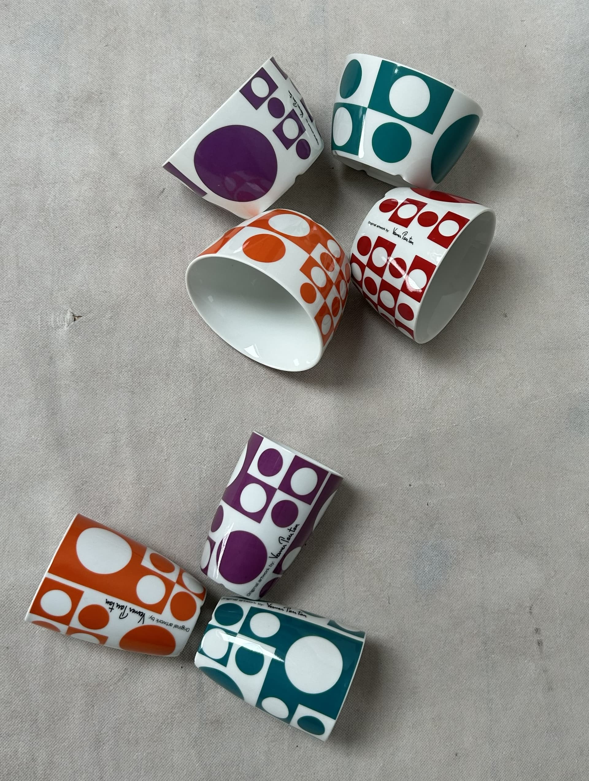Set of mugs and bowls Geometri 1, white porcelain with purple, orange, blue, red decoration, by V. Panton, Denmark, 1960s. - 306508