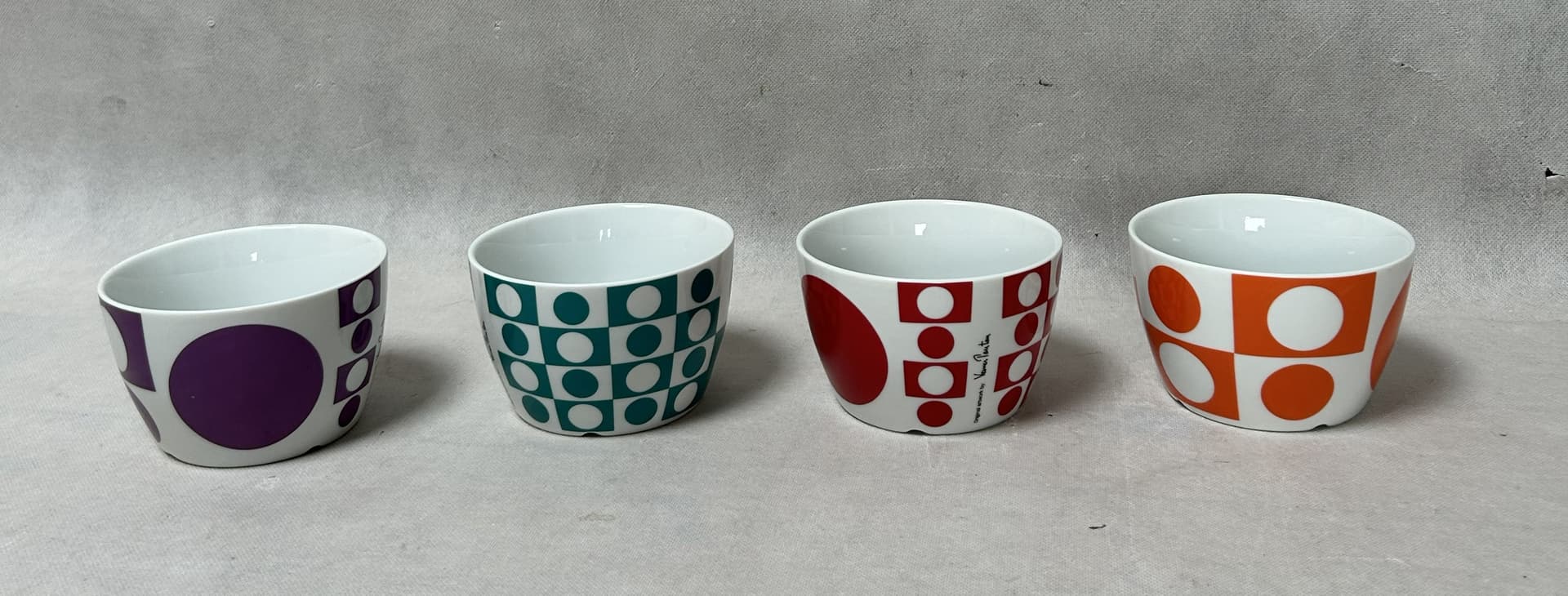 Set of mugs and bowls Geometri 1, white porcelain with purple, orange, blue, red decoration, by V. Panton, Denmark, 1960s. - 306500