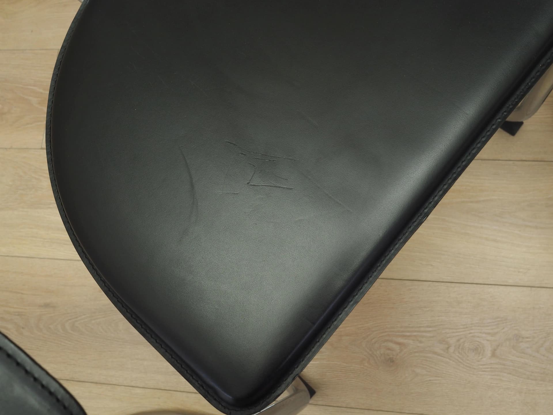 Set of four chairs, black leather, chromed metal, Italy, 1980s. - 22665