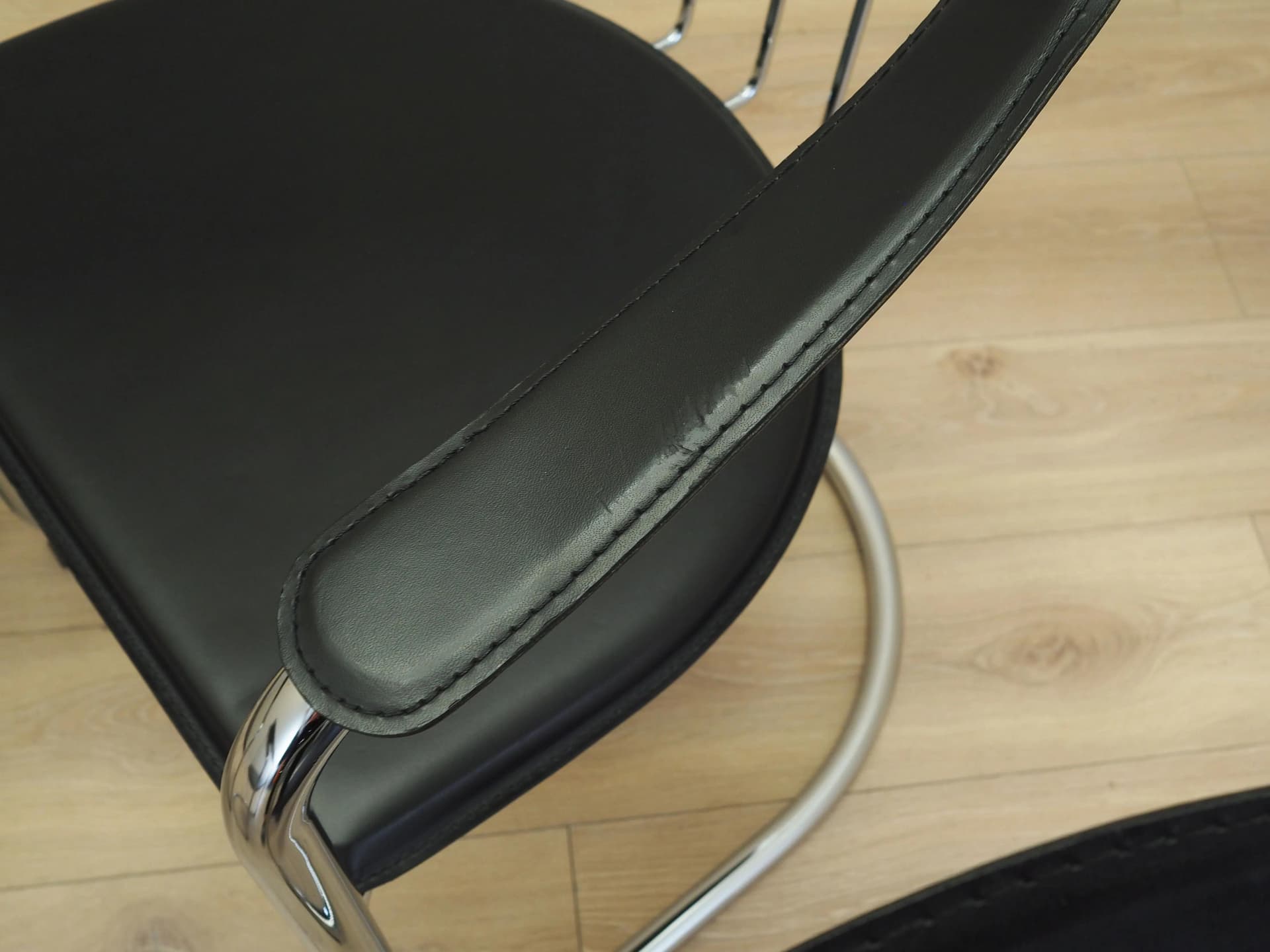 Set of four chairs, black leather, chromed metal, Italy, 1980s. - 22667