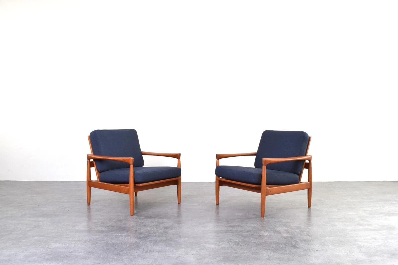 Pair of armchairs, brown oak, navy blue fabric, by E. Wørts, Ikea, Sweden, 1960s. - 315737