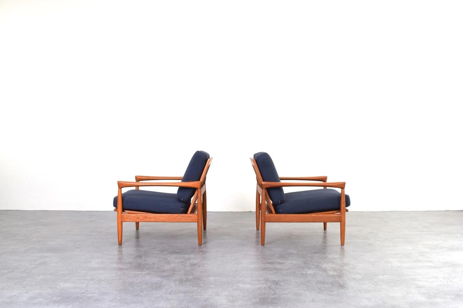 Pair of armchairs, brown oak, navy blue fabric, by E. Wørts, Ikea, Sweden, 1960s. - 315739