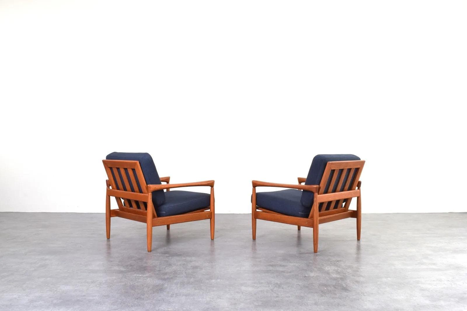 Pair of armchairs, brown oak, navy blue fabric, by E. Wørts, Ikea, Sweden, 1960s. - 315736