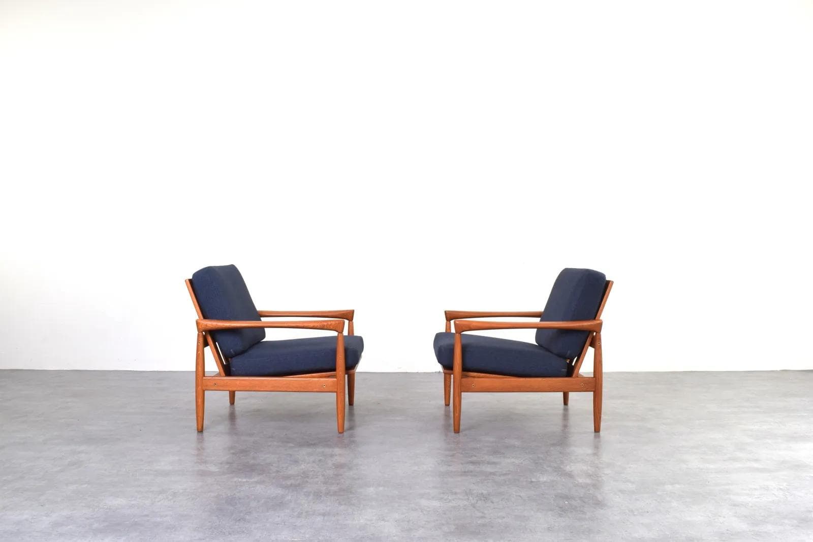 Pair of armchairs, brown oak, navy blue fabric, by E. Wørts, Ikea, Sweden, 1960s. - 315738
