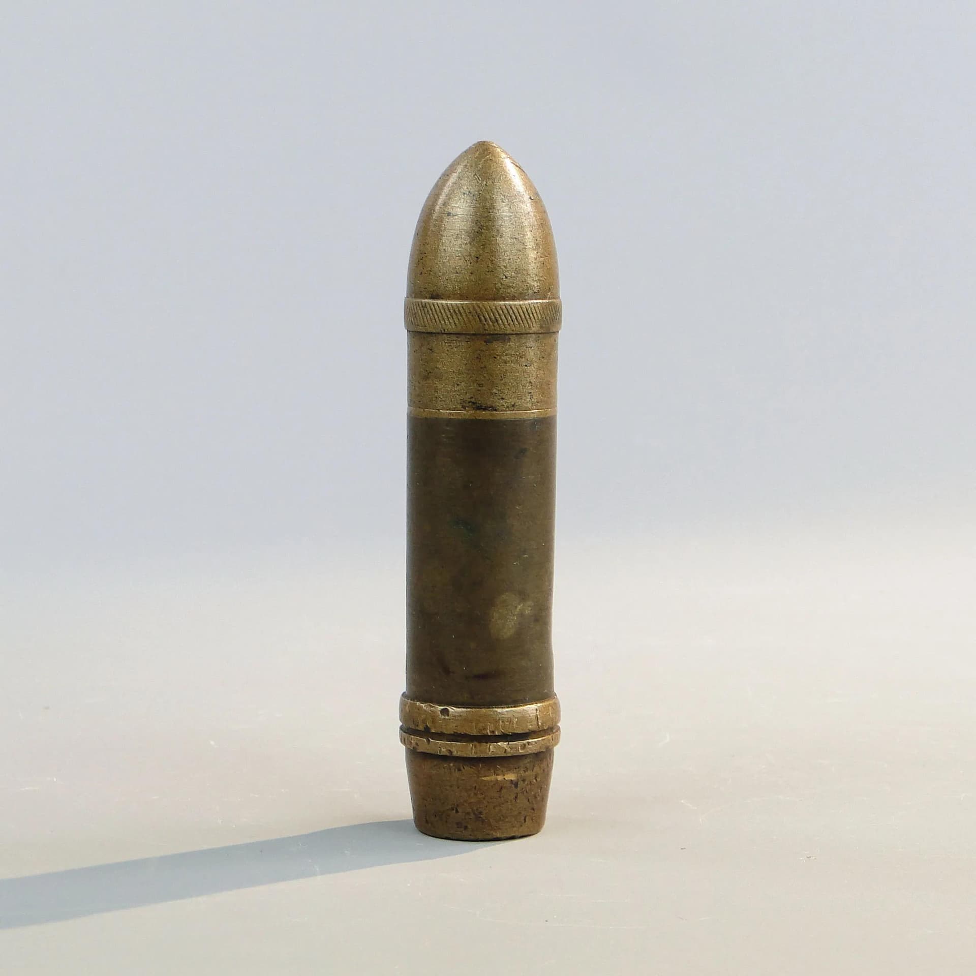 Zapalniczka benzynowa, forma pocisku, miedziany brąz, Polska, początek XX w. - 23633