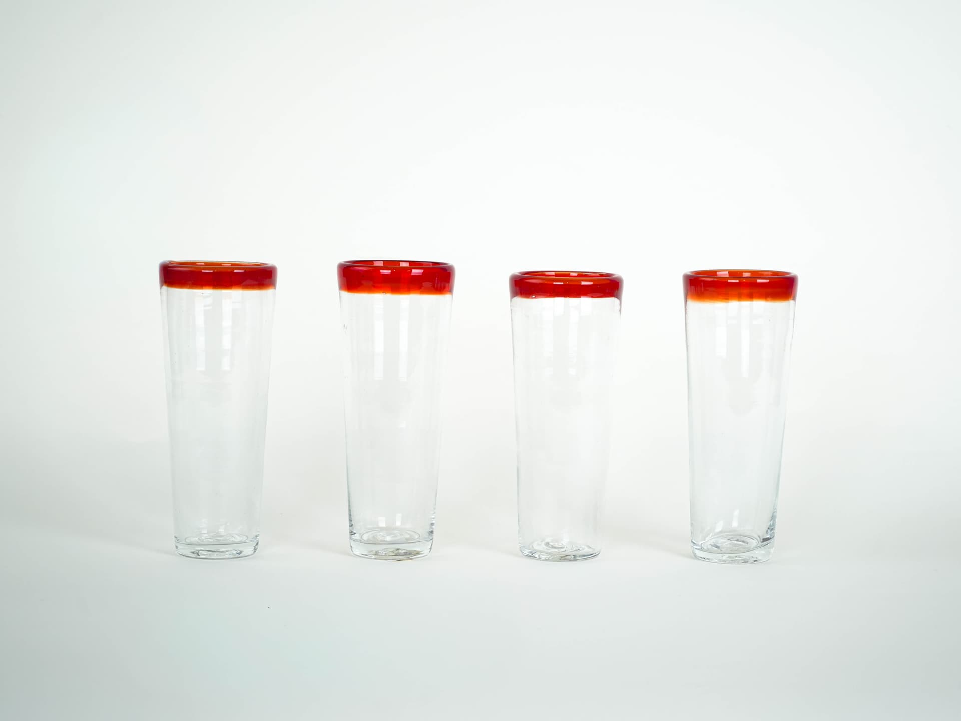 Set of four glasses, clear glass red-orange rim, Italy, 1970s. - 322059
