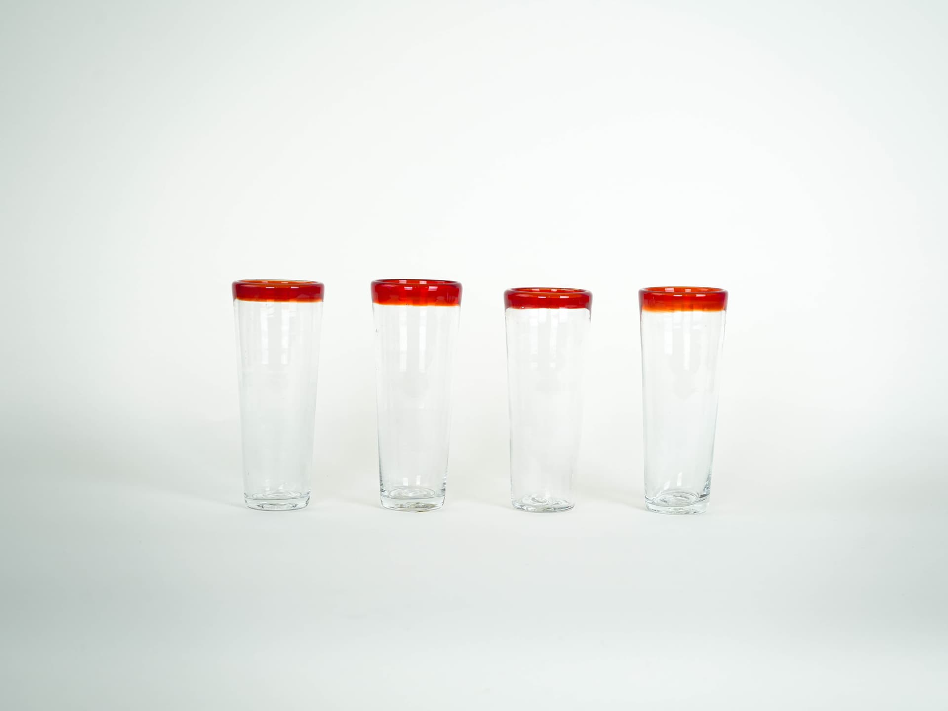 Set of four glasses, clear glass red-orange rim, Italy, 1970s. - 322058