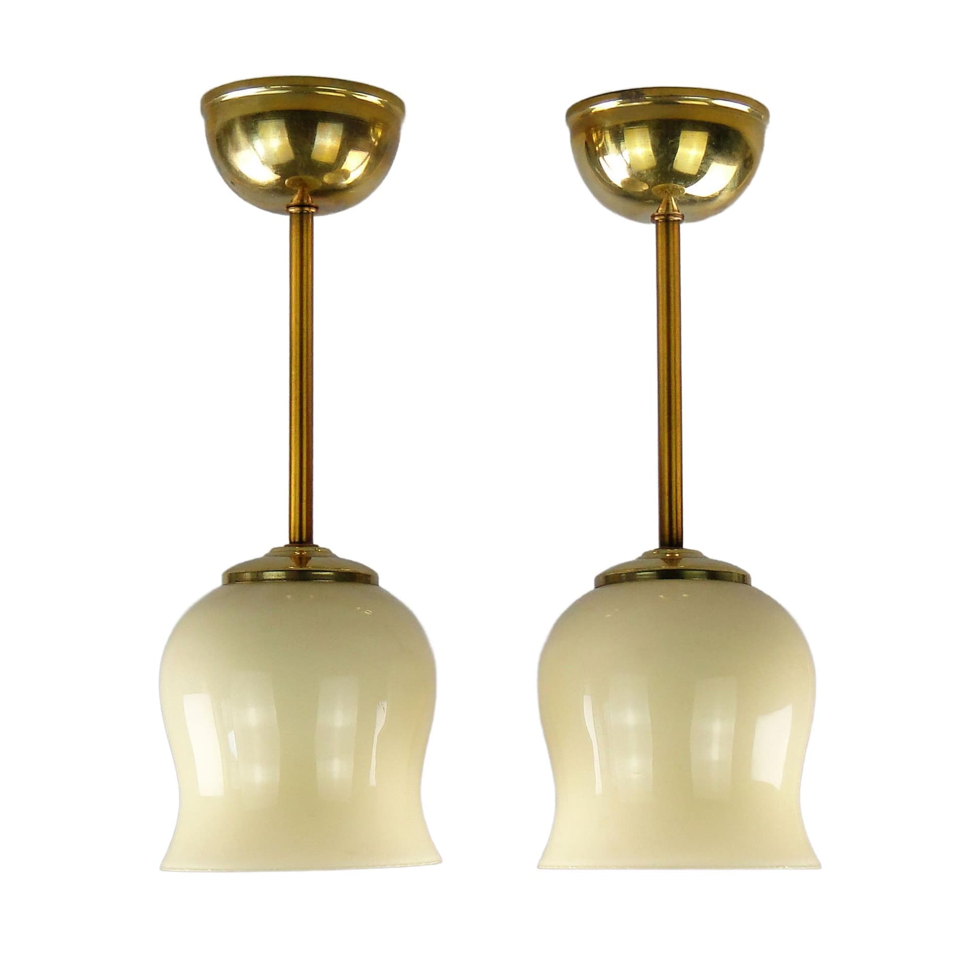Pair of ceiling lamps, ecru glass, brass, Poland, 1950s.