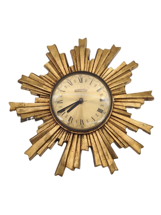 Wall Clock Sunburst, gold composite, black metal, glass, Germany, 1970s. - DIMENSION