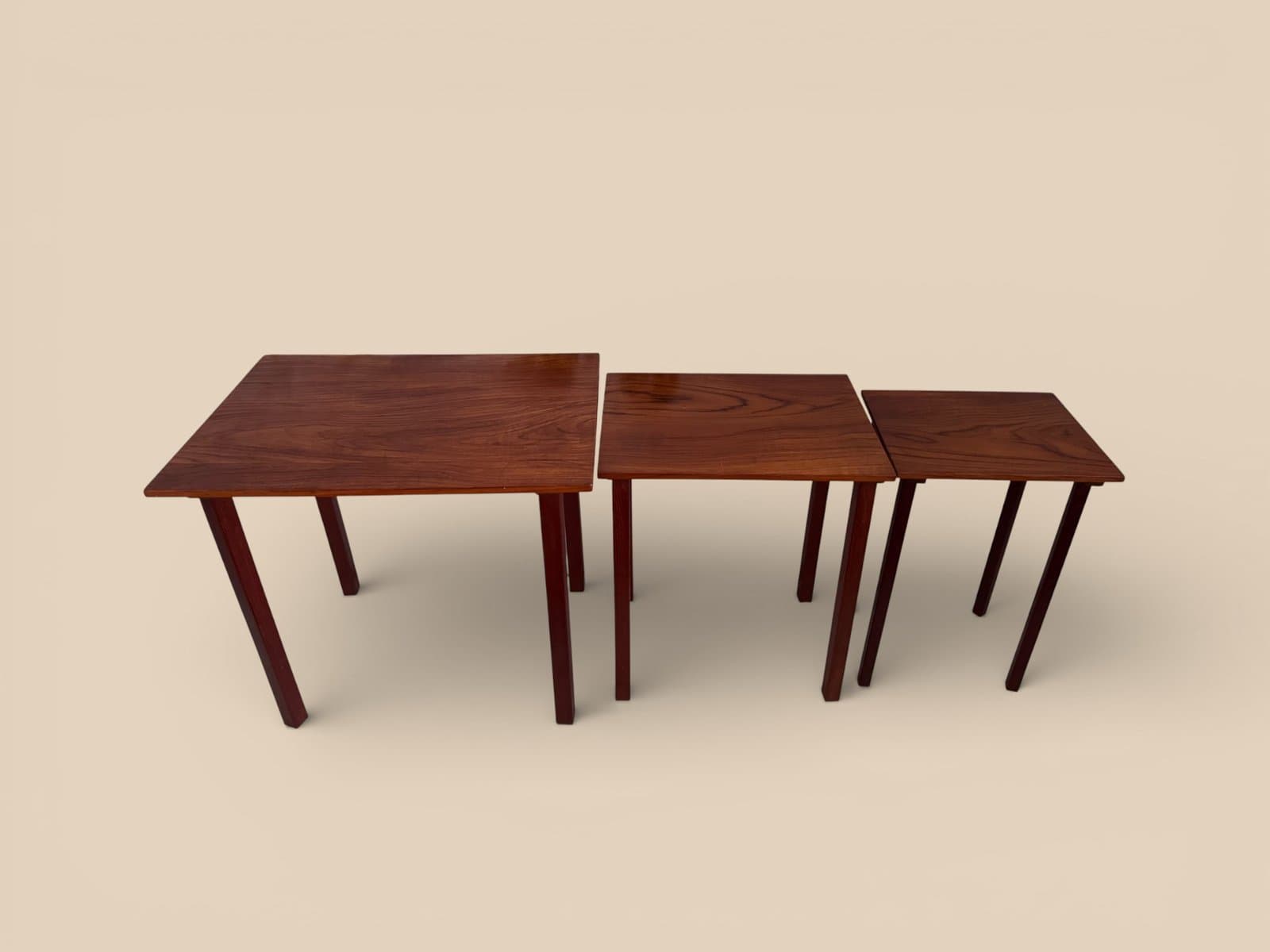 Set of three nesting tables, brown teak, Denmark, 1960s. - 327388