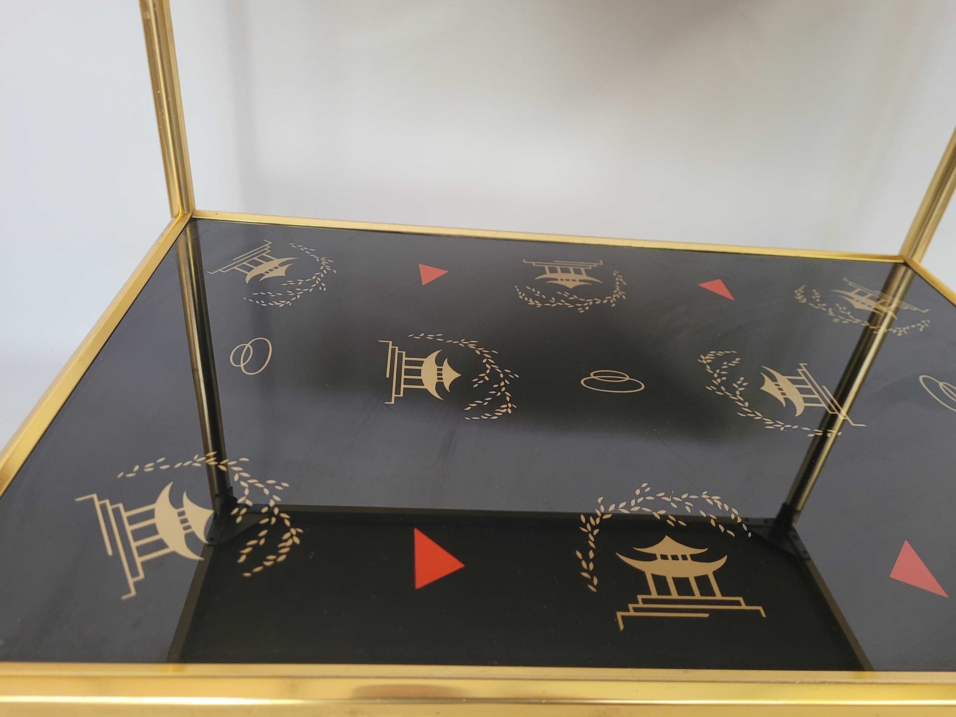 Side Table Chinese, gold aluminum, black glass, 1970s. - 327794