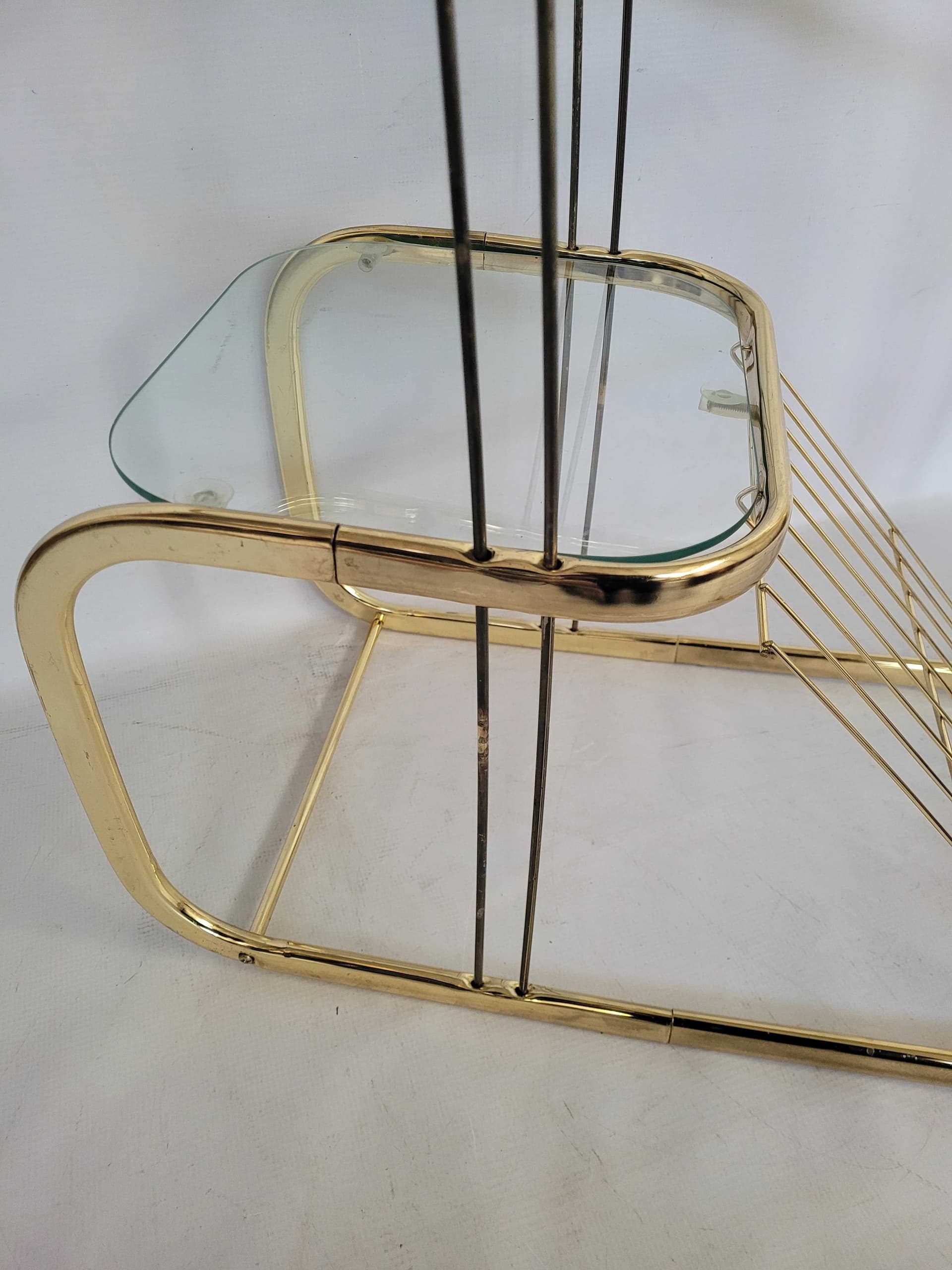 Side Table Magazine Rack Hollywood Regency, gold brass, transparent glass, 1980s. - 328428