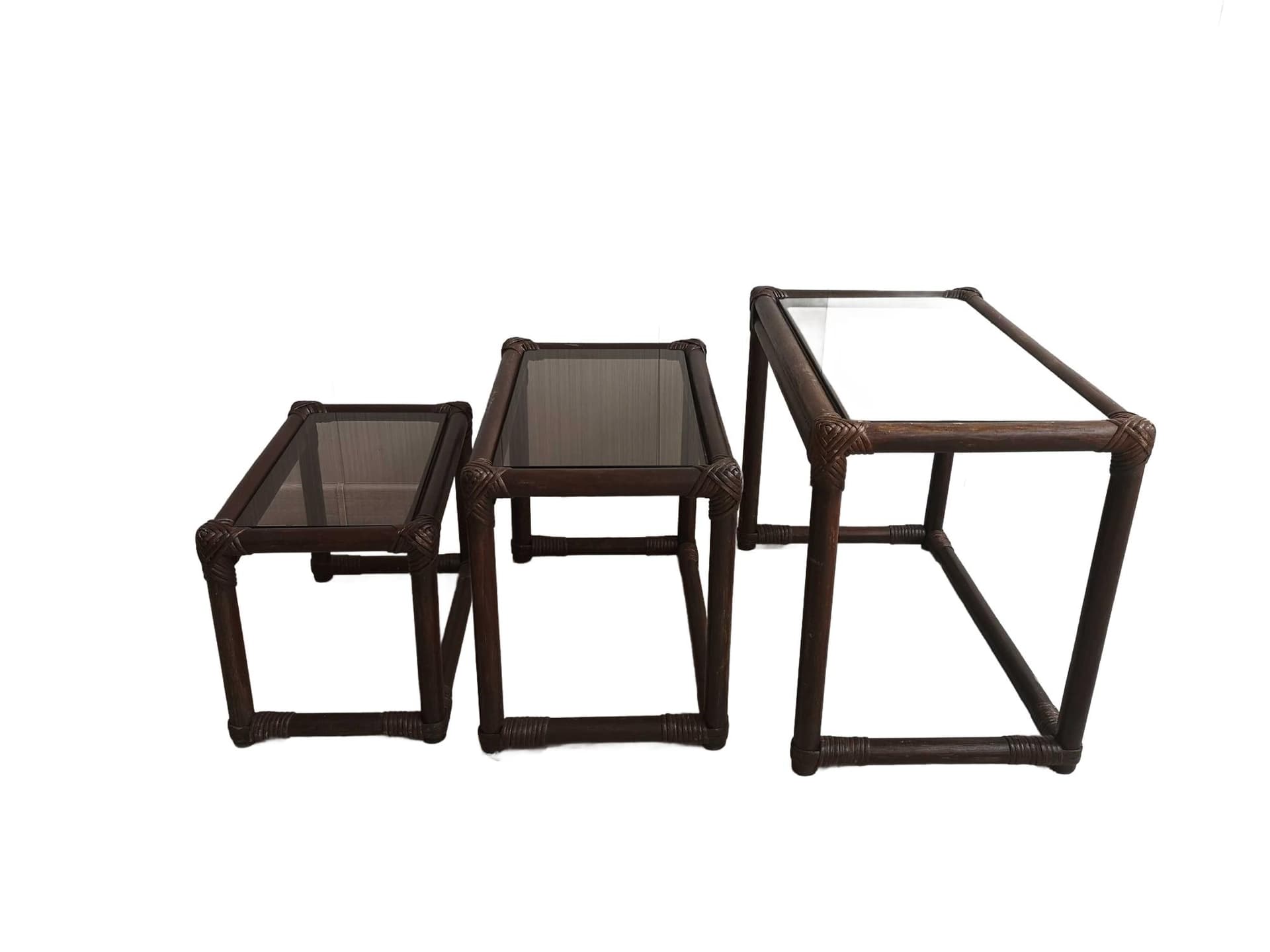 Set of three nesting tables, brown rattan bamboo, smoked glass, 1970s.