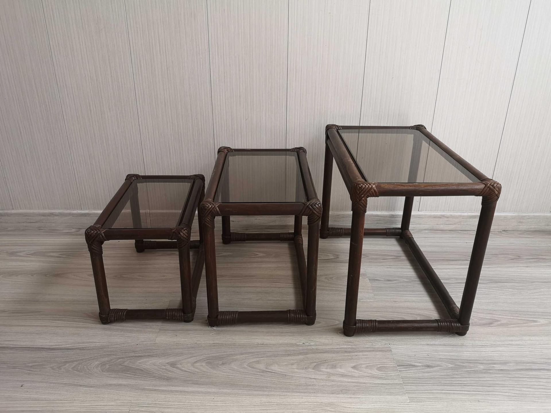 Set of three nesting tables, brown rattan bamboo, smoked glass, 1970s. - 331908
