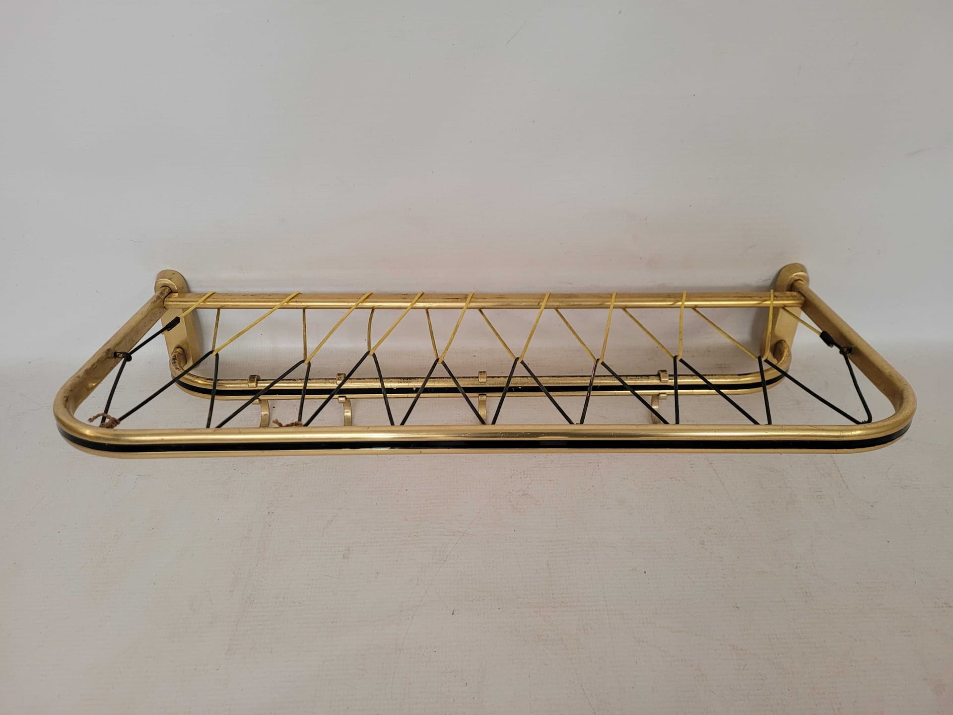 Wall-mounted rack, gold, aluminum brass, Poland, 1970s. - 331800