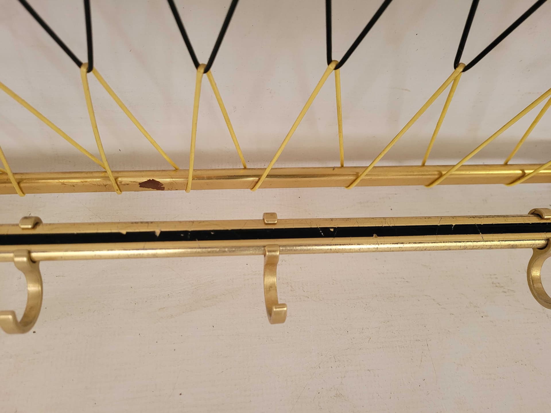 Wall-mounted rack, gold, aluminum brass, Poland, 1970s. - 331799